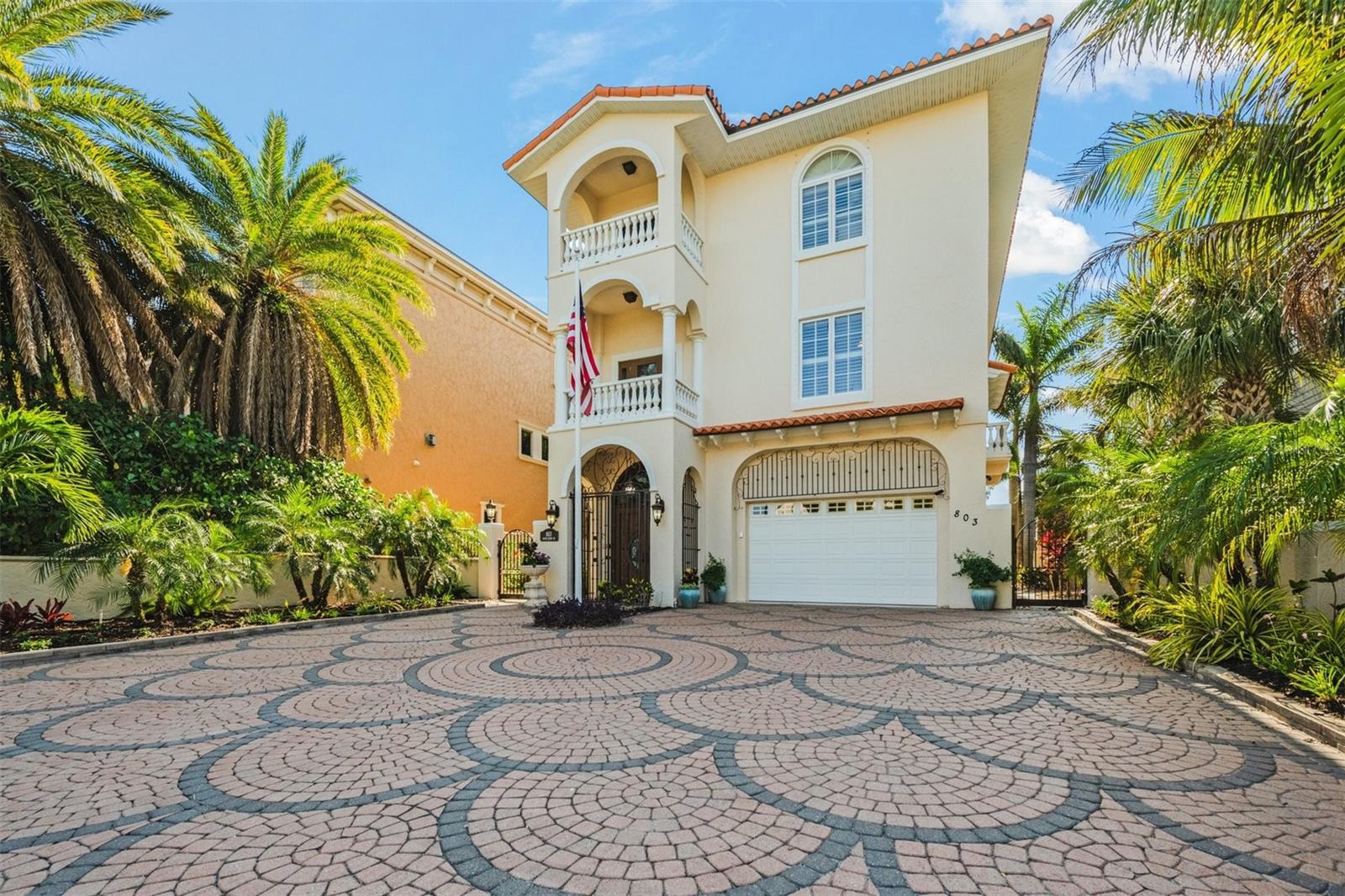 Direct Waterfront Turnkey Furnished home with over 4993 sq. ft. in living space with 4 bedrooms 4 baths, private office space or extra bedroom and unobstructed views of the Gulf of Mexico located in the exclusive North End of Anna Maria Island, Fl. "One of the 20th Greatest Beach Towns in America". Forbes ranks Anna Maria Island #3 as "Prettiest City in the Country". This dramatic three-story home greets you with paver driveway with extra parking, gated entry front Chautauqua Wood glass insert doors, tiled foyer and custom curved wood staircase and engineered wood flooring throughout the entire home. Luxury appointments include thermal-impact glass window and decorative art-stained glass wood doors throughout. The kitchen has decorative glass-stained range hood, custom glass backsplash, washer/dryer in pantry, oven, microwave, gas cooking area and custom counters with eating area, separate island and wine rack. The home has a formal dining room with Italian inlayed tile along with a large open living area, reading area, stone gas fireplace and glass arched windows and doors leading to an open covered balcony looking directly west to the Gulf. The 3rd floor can be reached by a carpeted stairway or elevator leading to a front reading room with balcony and 3 bedrooms. The Primary bedroom is reached through a muraled hallway leading through decorative art glass French doors facing the Gulf with two separate designer walk in ceadar lined closets, reading area, gas stone fireplace and en suite bathroom. Little things catch your attention; remote controlled shades leading to the balconies including kitchen and bath windows, heated pool with turtle ceramic tiles in the bottom and (2) fireplaces just in case you get a cold alert, separate washer/dryer on third level, an extended two car garage with room for a Golf Cart, a recreation room leading to the heated pool and barbeque area with metal fence and gate leading to the Beach. Four (4) Security Cameras monitor the property and are activated remotely and within the property. Call for a private showing and see for yourself the attention to detail this unique home unlike any other on the Island.