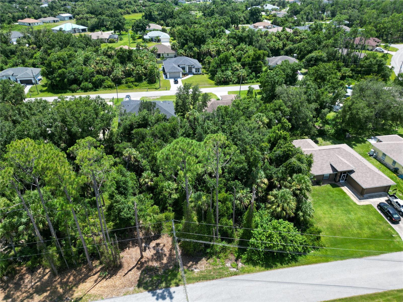 This vacant lot is tucked away in North Port, yet it’s just minutes from I-75, making trips to Sarasota, Venice, Port Charlotte, or even Naples quick and convenient. You’ll also be just a short drive from Wellen Park, a new community full of shops, dining, parks, walking trails, live entertainment, and the Atlanta Braves Spring Training stadium.The City of North Port continues to pop with new homes, schools, and businesses, which makes this the perfect time to secure your piece of land here in Sarasota County. With no HOA restrictions, you’ll enjoy the flexibility of designing your dream home, plus you’re close to Gulf beaches, golf courses, and beautiful nature preserves! Whether you’re dreaming of building your forever home or looking for a smart investment, this location checks all the boxes. And if you’d like assistance on the building process, our trusted custom home builder is available to walk you through every step and answer your questions!