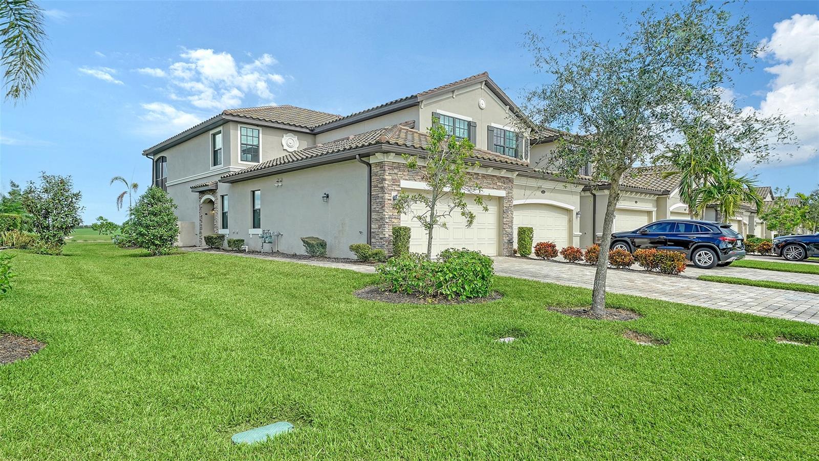 Stunning lakefront coach home in Lakewood National. Ready to book for next season, 3 Month Minimum. Located within a secure, gated community with 24/7 security, this home provides access to a grand Amenity Center, a state-of-the-art fitness center, a resort-style lagoon pool, Tiki bar, casual cafe, full-service spa, tennis courts, and a 36-hole Arnold Palmer-designed golf course for the ultimate golf experience. Relax in a serene space with plush furnishings and breathtaking lake views from your private screened lanai furnished with comfortable outdoor seating. A BBQ smoker and grill are being supplied for grilling when you’re not at the clubhouse pool- choose the private pool directly across the street! NO pets. The membership fee is $642.00 for the duration of your stay with a $65.00 food and beverage monthly minimum. Make this luxurious lakefront condo your next vacation destination! Call or Text Today!