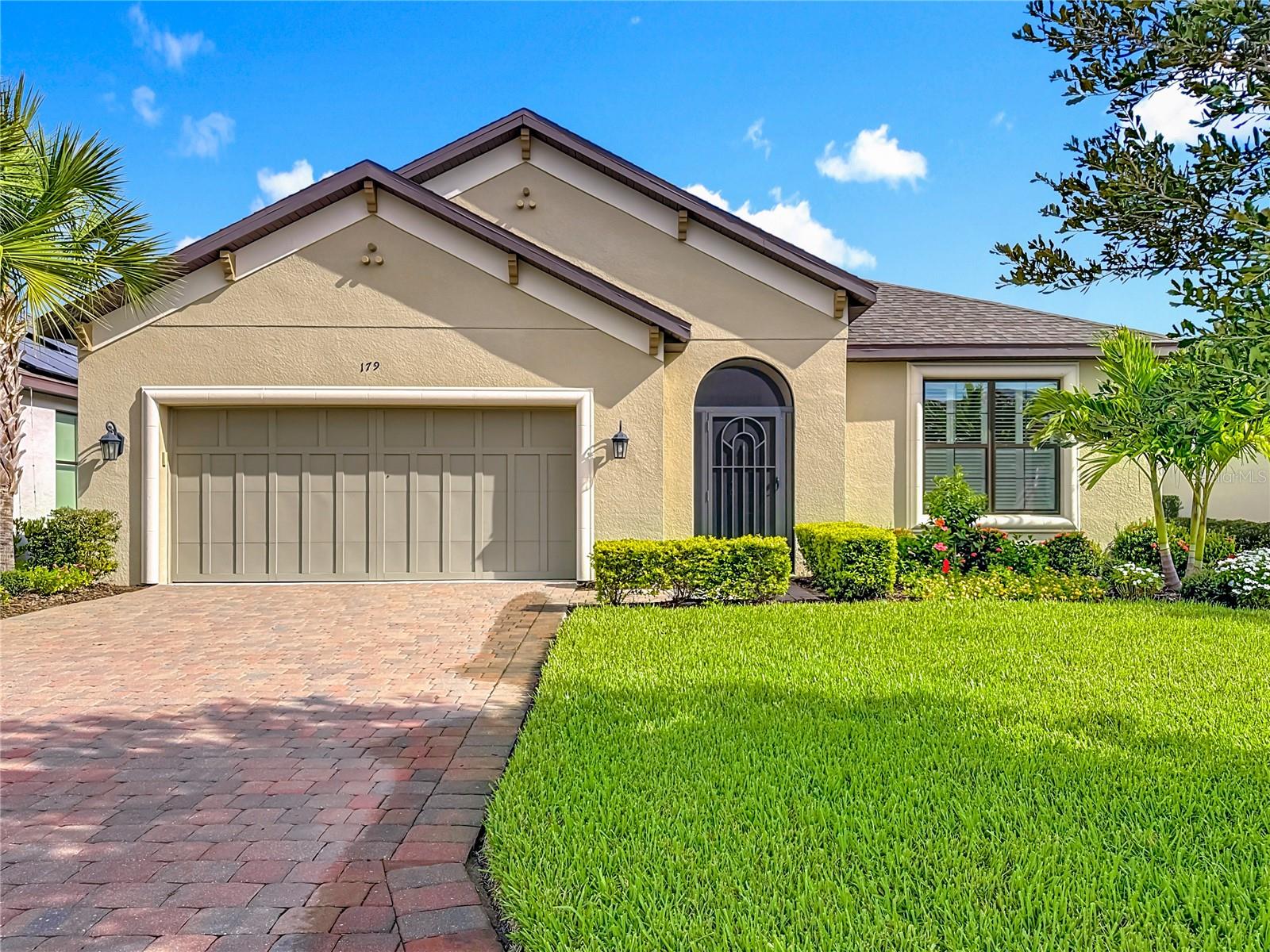 Welcome to this NEWER Dolcetto model with a GORGEOUS VIEW of the WATER. **See the FULL LENGTH VIDEO on Tour Link 1.** Upon entering this BEAUTIFUL home, notice the two TRAY ceilings in the FOYER. Open Floor plan, Plantation Shutters, Screened Front Porch, Designer Lights, Ceiling Fans, Ceramic Tile, 8 foot DOORS, Dual Pane WINDOWS, and Carpet in the bedrooms. This home has it all!! The Gourmet KITCHEN is open to the Great Room and Dining room, and features GRANITE counters, NEWER Stainless Steel appliances, pull out drawers, plenty of STORAGE, HUGE Walk-In pantry, and a lengthy BAR. The GREAT ROOM is the HEART of the home, and is an awesome place to entertain your guests while boasting recessed lighting and three sliders leading into the LANAI. Enter into the FLEX ROOM through French Doors. This room could be used as a Den, TV Room, or an Office. The OWNER'S SUITE has plenty of natural light, a GREAT view of the water, and an ensuite bath with a HUGE walk-in shower and dual sinks. The split floor plan offers privacy for all, and the SECOND Bedroom is COMFORTABLE for guests. Walk into the screened-in roomy covered LANAI with two remote control fans, and stay cool while enjoying the delightful WATER VIEW. There ia a FENCE in the backyard. The LAUNDRY ROOM has a newer washer and dryer, and both are included in the sale. Two car GARAGE with an EPOXY FLOOR, and access LADDER with partial plywood flooring in the attic. Included in the sale is a 2024 EVOLUTION Golf Cart with a Lithium battery and a multi-year WARRANTY. ***Solivita is an active adult 55+ community located in Kissimmee, Florida. It is approximately 50 minutes from Disney World & the Orlando International Airport. Solivita has a total of 5,470 homes. Approximately 10,000 - 11,000 people live in Solivita during the winter while approximately 7,500 live in Solivita during the summer. Enjoy your active years in this piece of paradise. Solivita's amenities include: - a manicured SOFTBALL diamond & field - 36 holes of CHAMPIONSHIP GOLF that can be played by joining the Stonegate Golf Club or paying as you go - 2 STATE of the Art AMENITY centers with updated exercise equipment, yoga studio & meeting rooms - 3 restaurants - 14 HEATED POOLS - 17 PICKLEBALL courts - 9 TENNIS courts - 4 BOCCE BALL courts - 4 SHUFFLEBOARD courts - 3 HORSESHOE pits - a BILLIARDS room - miles of bike paths - 2 DOG PARKS (Small & Large Dogs) - Corn Hole - Tot Lot PLAYGROUND - COMMUNITY GARDEN - over 250 resident clubs. The HOA: - maintains the LANDSCAPING & IRRIGATION systems in the common areas as well as at individual homesites - maintains the roads throughout the community - PROVIDES SECURITY with gate guards and mobile patrols including the Polk County Sheriff - allows AUTOMATED GATE ACCESS for residents via license plate readers - provides residents with Fiber Optic Internet & TV service.***Poinciana Lakes Plaza is a MAJOR NEW SHOPPING CENTER that opened directly across from the Solivita Main Gate in Summer of 2024. It features Sprouts Grocery, TJ MAXX, Ross, Burlington, Rack Room Shoes, 5 Below, Ulta, Outback, First Watch, 5 Guys, Urgent Care, Dentist, TD Bank, Petco & Hair Cuttery PLUS MORE TO COME.***