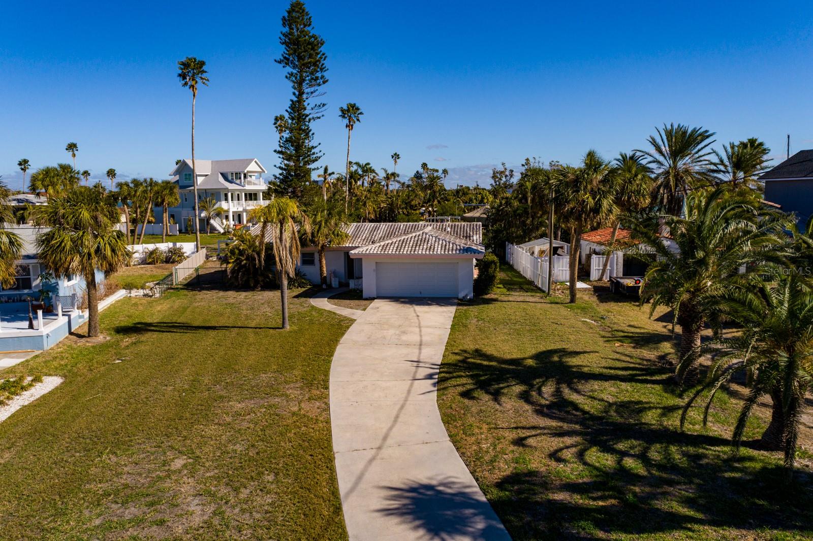 Beautiful bay views from this home situated on a large 14,453-square-foot LOT with DOCK. Being sold at lot value! There is a cinder block home that is storm-damaged which CAN BE renovated or removed to build your dream home in the charming Redington Beach community. A great investment, new and newer elevated waterfront homes sell in the multi-millions. Redington Beach is a charming beach town, and you can drive, bike or go to this community's private beachfront access and parking. Being sold as-is. Assumable flood policy and letter showing reversal of substantially damaged available which allows for renovation. BRING AN OFFER!