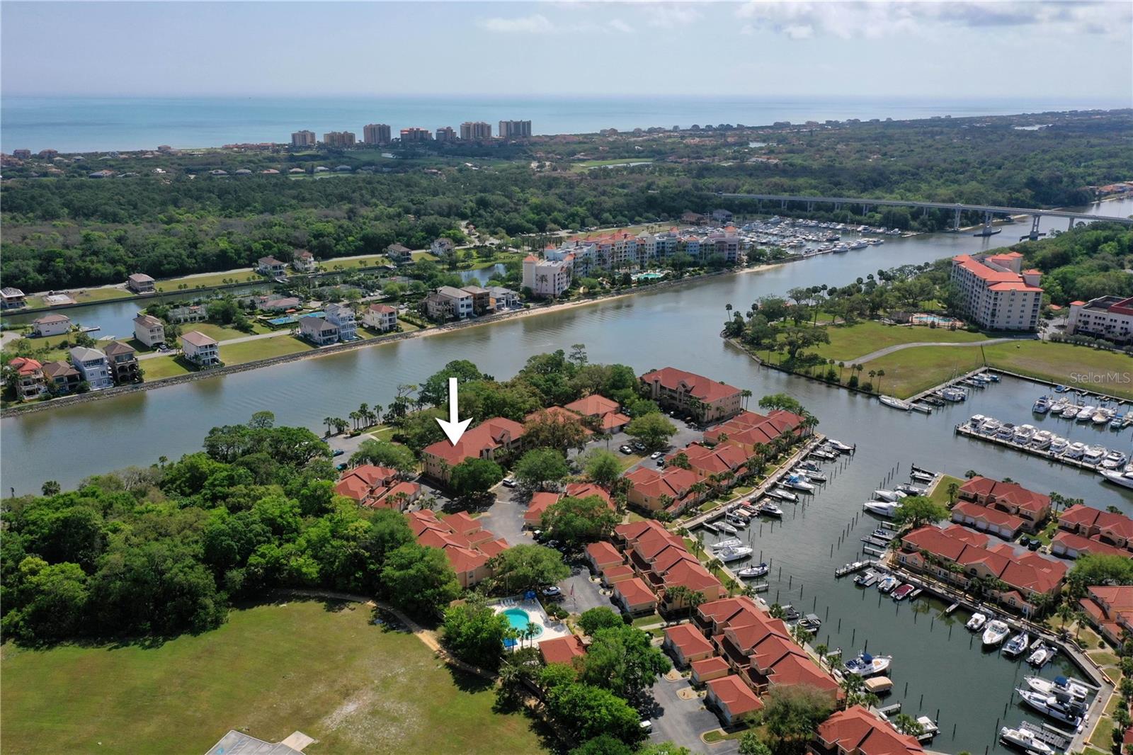 Waterfront living meets comfort and style in this competitively priced top-floor, corner-end 3-bedroom, 2-bath condo on the Intracoastal Waterway, offering abundant natural light, vaulted ceilings, and serene water views from the kitchen, living room, primary bedroom, and screened lanai. Fully renovated in 2023 with luxury vinyl plank flooring and stylish ceiling fans, the home features a chef’s kitchen with high-end stone countertops, crown-molded wood cabinetry, soft-close drawers, ample storage, and stainless-steel appliances, including a 2023 range and 2022 refrigerator, plus a 2025 washer and dryer. The welcoming entryway boasts a solid wood front door with pull screen for cross-breezes, a Ring doorbell, and keyless Schlage lock, leading to a spacious layout where two guest bedrooms—each large enough for a king bed—provide flexible options for an office, gym, or hobby room. The guest bath offers a tub/shower combo, porcelain countertop, touchless faucet, and modern fixtures (2024), while the primary suite is a serene retreat with vaulted ceilings, a renovated spa-like bath with double vanities, porcelain counters, matte-brass faucets, LED-backlit mirrors, and a frameless walk-in shower with designer tile and built-in bench. Enjoy morning coffee on the lanai while watching boats pass or take advantage of the community’s marina with boat slips, pool, clubhouse, pickle ball, tennis, shuffleboard, putting green, and waterfront park. HOA includes water, sewer, internet, and termite maintenance, and the pet-friendly location places you minutes from European Village, local dining, farmers’ markets, and the Hammock Bridge to pristine Jungle Hut Beach just 7 minutes away. Come view this serene condo and make an offer.