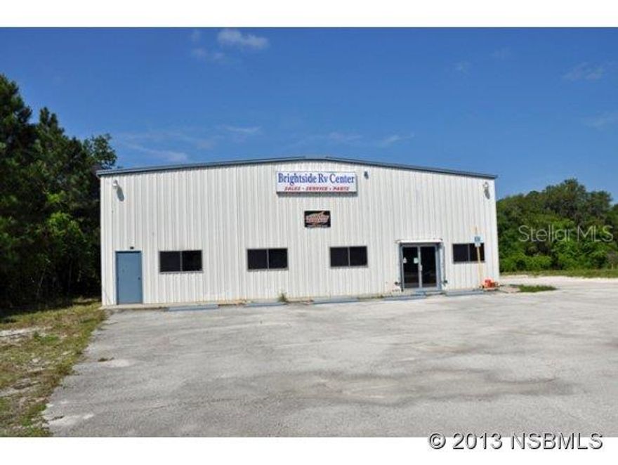 US Highway 1 commercial frontage with 60x140 building featuring showroom, 4 overhead doors with 57x23 canopy. Former RV repair facility. Ideal for boat works, automobile repair, salvage, storage. Secured fencing. Appx 198 of frontage. Rear portion zoned residentially & is partially cleared. Ten acres total.