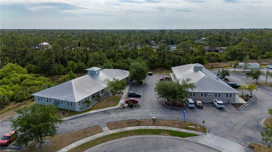 Exceptional income-producing property offers a rare opportunity to invest in the rapidly growing North Port/I-75 corridor. Situated in Sarasota County within the Bobcat Village Center and adjacent to the Sarasota Memorial Emergency Room, the property consists of two Key West-style buildings totaling approximately 12,100 heated square feet. Building #1 includes five units (approx. 5,800 sq/ft), and Building #2 includes six units (approx. 6,200 sq/ft). All units are currently leased, offering a 100% occupancy rate and immediate cash flow for the new owner. The site features 50 on-site parking spaces and is zoned PCD (Planned Community Development), a highly flexible designation that allows for a variety of uses including medical, office, daycare, and more. These buildings are to be sold together and cannot be separated. Ideally located just 3 miles from I-75, 2.5 miles from US-41, and directly across from a premier golf course community, this well-maintained property presents a compelling opportunity for investors seeking stable income and long-term growth in a high-demand area.