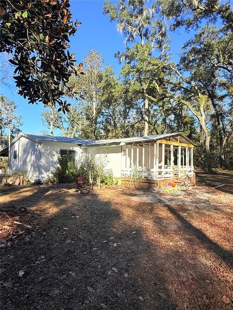 Photo of 1377 NE 143rd Avenue, Old Town, FL 32680 (MLS # GC534653)