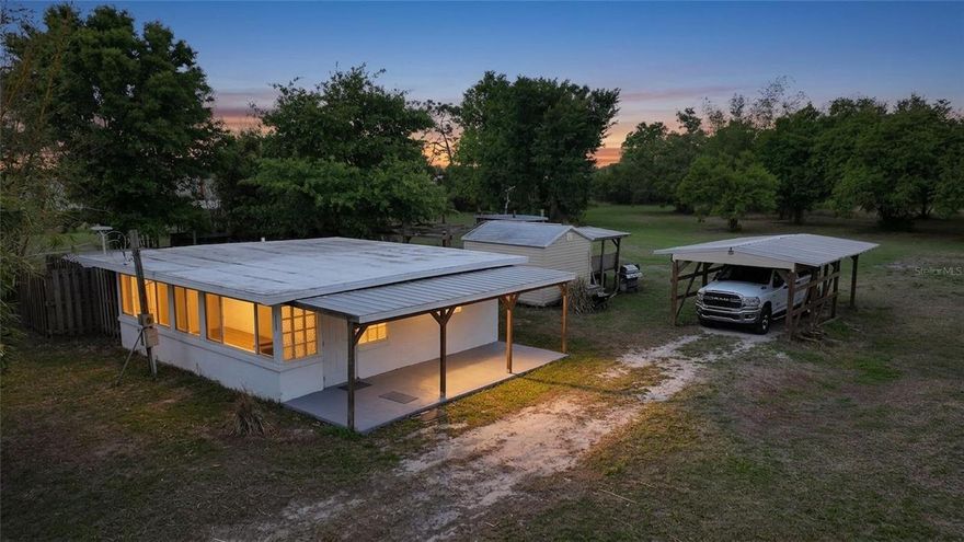 If you’ve been looking for space, privacy, and something that just feels easy… this one is worth a look. This one-bedroom, one-and-a-half bathroom concrete block home sits on over five acres and has already had some great updates done for you, including newer flooring, newer windows, and a newer mini-split A/C system. Inside, the layout is simple and functional, with a living room lined with wall-to-wall windows that bring in tons of natural light. The kitchen is practical and includes a reverse osmosis system under the sink. Step outside and you’ll see where this property really shines. There’s an outdoor soaking tub, outdoor shower, and half bath, plus a screened-in area that’s perfect for winding down in the evenings. You’ve also got a utility shed and carport for everyday convenience. The land is fully usable and zoned for animals, with beautiful mature oaks, scattered bamboo, and fencing already in place along the front. Whether you want a small homestead setup or just room to spread out, there’s plenty of opportunity here. Simple, functional, and set on a really pretty piece of land.