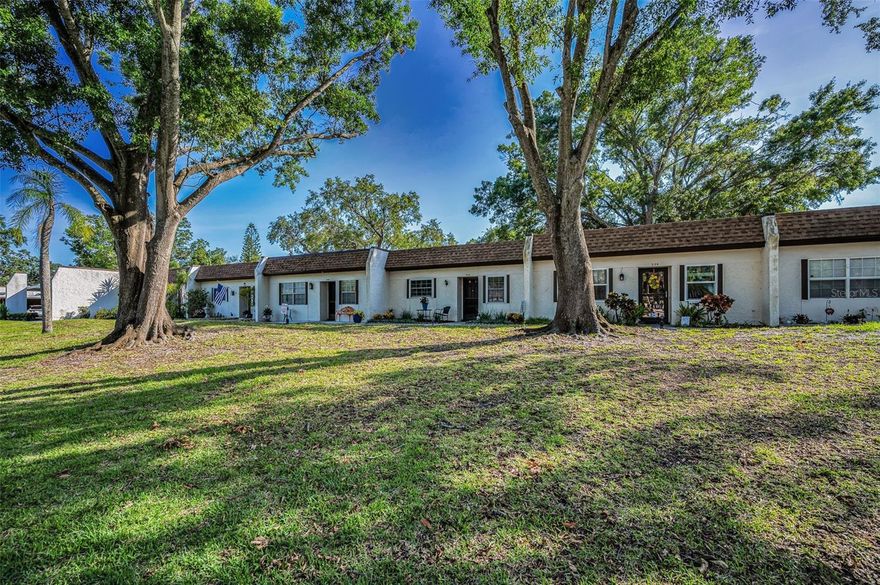 Lovely Highland Lakes villa located in Mission Grove. This villa is conveniently located just two blocks from the clubhouse and all of the amenities this golf course community offers. Villa shows light and bright. Newer laminate floors provide very easy maintenance of flooring. Finished Florida room overlooks a beautifully landscaped courtyard. Great room floor plan with pass through from kitchen. Larger bedroom has built-in Murphy bed with loads of storage. Washer and dryer are in a laundry closet and do convey. Villa has replacement, double pane windows for energy efficiency and whisper quiet interior environment. Villa conveys with an assigned carport, storage closet and room for golf cart parking. Mission Grove has their own swimming and additional laundry facility. Highland Lakes is a very active adult community with a golf course, resort style heated pool and hot tub. There is a monthly calendar of events which includes multiple clubs and live entertainment. Clubhouse has a library, card and billiard rooms, auditorium and wood working/ceramics workshops. Pickle ball and tennis courts for the more active residents. Second pool is at the lodge which overlooks Lake Tarpon. There is secured RV/boat storage when space is available.
