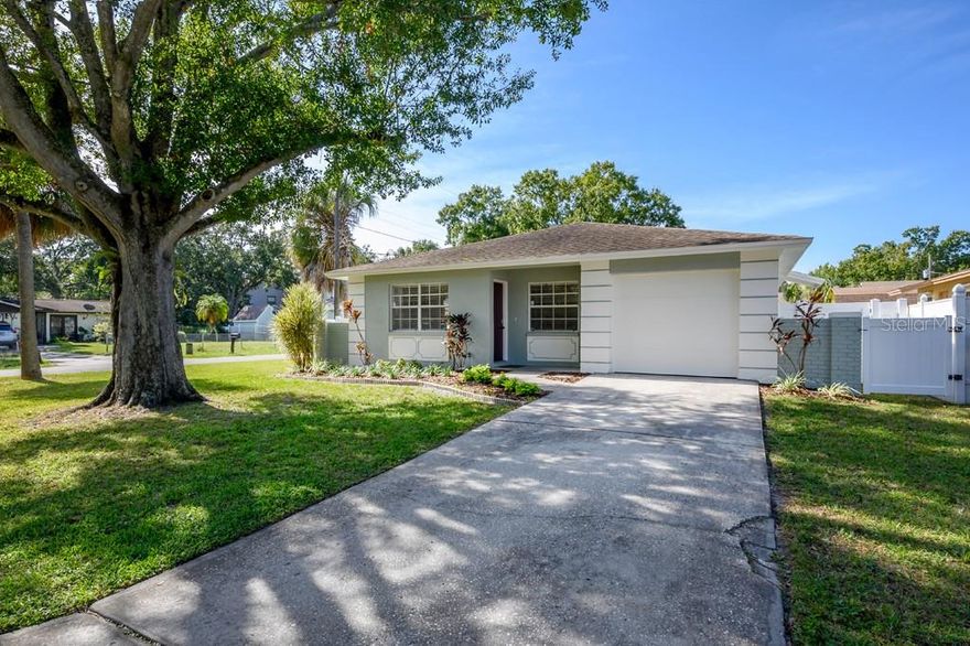 South Tampa Gem on a Corner Lot — Move-In Ready!  Discover this beautifully updated 3-bedroom, 2-bath South Tampa home, perfectly positioned on a spacious corner lot in a desirable south Tampa location. This home is completely turn-key and ready for you to move right in.  Step inside to find an open, light-filled layout featuring new luxury vinyl plank flooring throughout most of the home. The modern kitchen showcases quartz countertops, stainless steel appliances, and custom cabinetry, creating the perfect space for cooking while entertaining your guests.  The large primary suite includes a gorgeous updated ensuite bath, while both bathrooms feature brand-new vanities and stylish tile finishes. Each bedroom comes equipped with custom closet organizers, adding both function and sophistication.  Enjoy Florida living in the spacious, fully fenced backyard—complete with a vinyl privacy fence and a large roll gate, ideal for boat or camper storage. The oversized attached garage offers plenty of room for parking and extra storage.  Additional updates include a newer hot water heater, ensuring peace of mind for years to come.  Located just minutes from MacDill Air Force Base, parks, restaurants, and shopping, this home offers unbeatable convenience and a true South Tampa lifestyle.