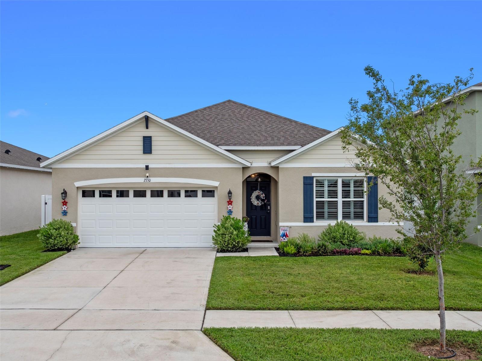 This 4-bedroom home sits on a quiet cul-de-sac in the amenity-rich community of Avalon Park. Built in 2022, the home has a great single-level layout, with design details and upgrades you won’t find anywhere else. Inside the front door, you’ll notice the tile flooring in the living spaces, along with the plantation shutters, modern fixtures and all the natural light.
The front part of the floorplan includes three guest rooms, an updated hallway bathroom and a drop zone at the entrance to the 2-car garage. Even the laundry room here includes clever built-in storage.
The kitchen anchors the back of the floorplan and overlooks both the dining & living rooms. The timeless kitchen features granite countertops, stainless appliances, a walk-in pantry and an island with seating for a crowd.
Just off the living room, the corner primary retreat boasts a large ensuite with a granite-topped double vanity, a W/C and a walk-in closet.
What a backyard! This nearly maintenance-free space includes a lanai along with a screened enclosure (rare here!) over a large paver patio. There’s a swim-spa with a built-in bar and you still have plenty of space to lounge, grill and entertain. The rest of the fenced-in yard offers privacy and lots of gardening options.
Residents of Avalon Park enjoy amenities like a community pool, playground, walking paths and lake views. Just a mile from your front door, there are countless shopping & dining options along Rt 441. You’ll also be close to all the lakeside restaurants & quaint shops in downtown Tavares and historic Mt. Dora. This nearly-new home won't last