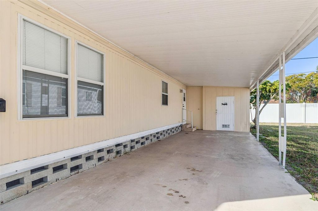 Photo of 86 Pindo Palm Street W, Largo, FL 33770 (MLS # TB8457451)