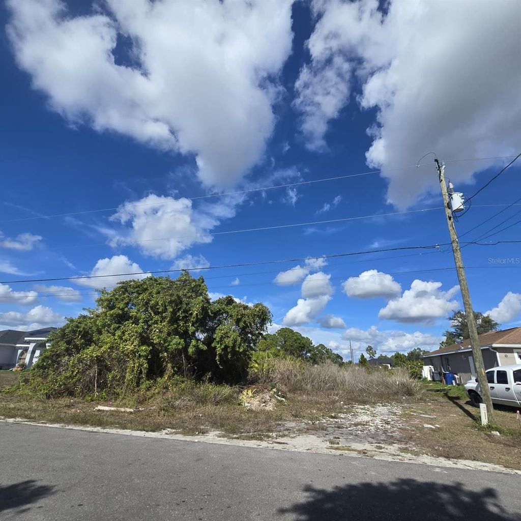 Photo of 2804 E 11th Street, Lehigh Acres, FL 33972 (MLS # O6381945)