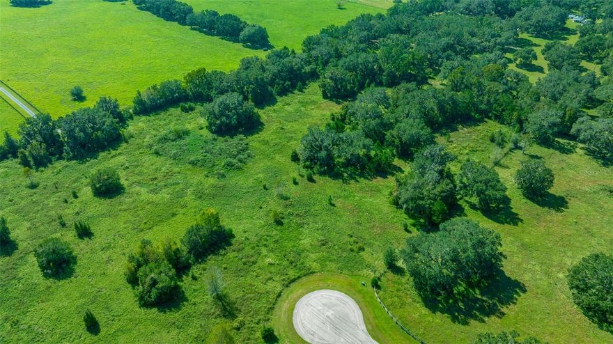 ATTENTION!  HUGE PRICE ADJUSTMENT! Welcome to Paradise Farm—the perfect setting for your DREAM equestrian estate or mini farm! Just 3 miles north of HITS and less than 15 minutes from the World Equestrian Center, this prime location offers unmatched convenience for horse enthusiasts. With direct access off Hwy 27, traveling to all equestrian venues is effortless. Paradise Farms is a gated community featuring paved roads, underground utilities, and partially cleared pasture land—ready for your vision. The neighborhood is flourishing with stunning new homes and farms, making it an ideal place to invest and grow. Tucked away on a quiet cul-de-sac, this property provides the space and potential to create your DREAM farm, complete with a custom home, barn, and paddocks designed to your liking. Don’t miss this opportunity to bring your equestrian lifestyle to life in the heart of NW Marion County!