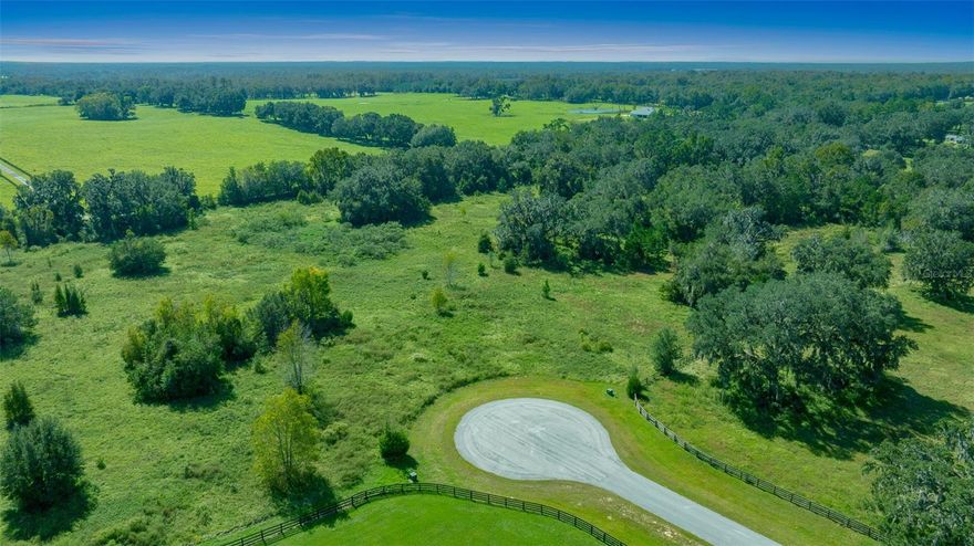 ATTENTION!  HUGE PRICE ADJUSTMENT! Welcome to Paradise Farm—the perfect setting for your DREAM equestrian estate or mini farm! Just 3 miles north of HITS and less than 15 minutes from the World Equestrian Center, this prime location offers unmatched convenience for horse enthusiasts. With direct access off Hwy 27, traveling to all equestrian venues is effortless. Paradise Farms is a gated community featuring paved roads, underground utilities, and partially cleared pasture land—ready for your vision. The neighborhood is flourishing with stunning new homes and farms, making it an ideal place to invest and grow. Tucked away on a quiet cul-de-sac, this property provides the space and potential to create your DREAM farm, complete with a custom home, barn, and paddocks designed to your liking. Don’t miss this opportunity to bring your equestrian lifestyle to life in the heart of NW Marion County!