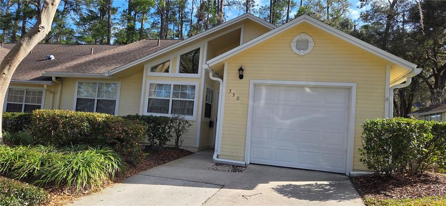 Maintenance free living in this spacious 3 bedroom 2 bath end unit with a 1 car garage. Newer HVAC and water heater. Master bedroom is oversized with walk in closet.   Enclosed back porch is perfect for entertaining. Community clubhouse and pool has a gym and a steam room. Convenient to I-75 and easy access to UF, Shands, the VA, grocery and nearby restaurants. HOA covers all exterior maintenance and lawn care.