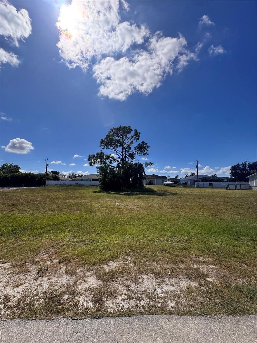 Build your Florida dream home on this beautiful vacant lot located in one of the most desirable areas of Cape Coral! This prime homesite offers paved street access, a flat and buildable lot, and all the conveniences of established neighborhood living. Enjoy the perfect balance of peace and proximity that is  just minutes from shopping, dining, schools, parks, and Cape Coral’s famous waterways. With city utilities nearby and newer homes all around, this property offers an excellent opportunity for builders, investors, or future homeowners alike. Don’t miss your chance to secure your piece of paradise in one of Southwest Florida’s fastest-growing communities
