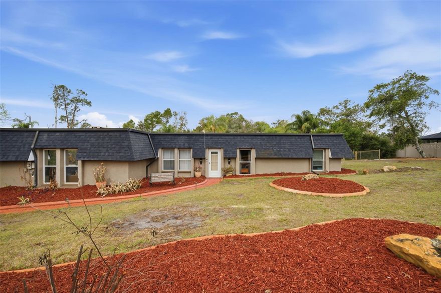 Beautiful, Spacious country estate pool home in the sought after Tanglewood subdivision! Located only miles from Green Key Beach and sits on an acre of beautiful landscape. NEWish roof. UPGRADED kitchen features solid wood Maple cabinets and granite countertops, recessed lighting and stainless steel appliances. UPGRADED bathrooms include granite and dual sink vanity in master featuring Italian tile in the walk in shower. Beautiful brand new wood plank tile floors, fireplace, and custom beams. The master has 3 closets for lots of storage, and a beautiful view overlooking gorgeous palm trees and pool! YES! there is an inlaw suite and its perfect for out of town company and has its own parking and separate keyed entrance, living room, bedroom, kitchen, dedicated tankless water heater and AC unit. Great office, entertainment space, or live-in family member needing space and privacy! The pool deck is oversized and can accommodate family gatherings with flow through doors leading into the den, the dining room and the inlaw suite with easy access to the garage half bath and outdoor pool bath complete with overhead heater! The custom pool features large jetty rocks for that beach feel and overlooks the massive back yard and large fire pit and picnic area with plenty of room for entertaining your guests under the shade of many beautiful palms. This equestrian subdivision is an easy commute to Tampa and plenty of shopping and entertainment close by.