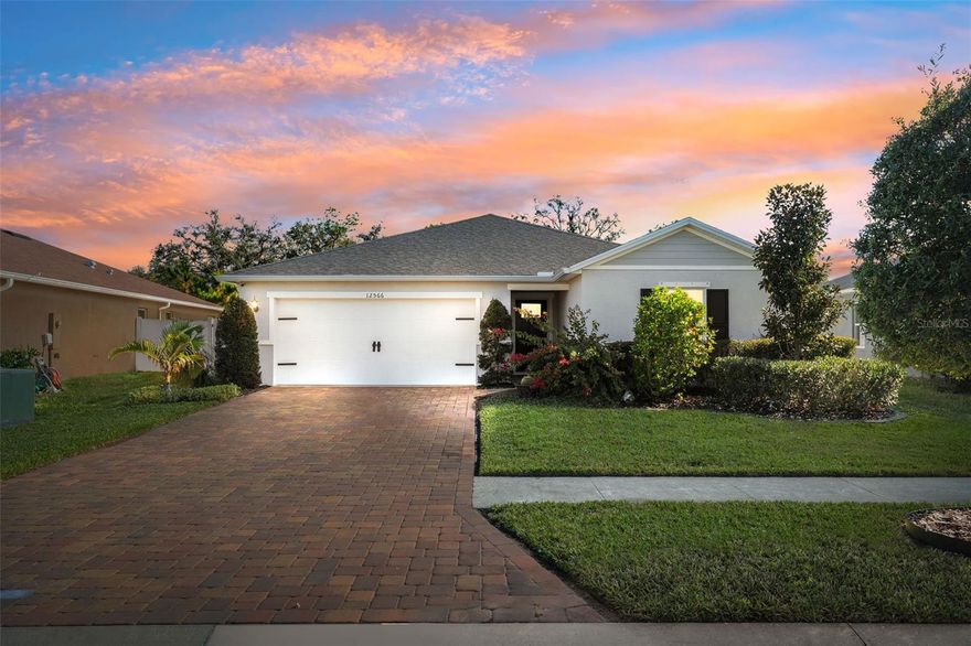 WELCOME to this inviting 3 bedroom, 2 bathroom HUDSON home, LOCATED in the desirable community of LEGENDS POINTE. With impressive curb appeal and a thoughtful open floor plan, this 1,566 sq ft home offers comfortable living with modern functionality. NO CDD and a VERY LOW HOA make this an affordable and attractive opportunity in a sought-after area. Enjoy spacious living and dining areas that seamlessly flow into the kitchen, perfect for entertaining or everyday life. The primary suite offers privacy and includes an ensuite bathroom with dual sinks and a walk-in shower. The split bedroom layout provides ideal separation and space for family or guests. Your new home offers valuable eco-friendly and modern upgrades, including installed SOLAR PANELS for energy efficiency and an electric vehicle charging plug located in the garage. Step outside to your fully FENCED BACKYARD, perfect for family, pets, and outdoor gatherings. Easy access to Suncoast Parkway for a quick commute to Tampa. Whether you’re hosting friends or watching the dog run, this space is ready for outdoor Florida living. Move-in ready and waiting for the lucky new owner. Don’t miss out, this one won’t last long!