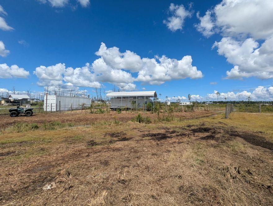 TAKE ADVANTAGE OF SELLER FINANCING WITH 10% DOWN FOR UP TO 15 YEARS! Welcome to your perfect off-grid retreat within the vast 50,000 acre River Ranch Property Owners Association (RRPOA), the premier ATV riding, outdoor recreation, and hunting destination in the US. This high-and-dry .31-acre lot offers a unique, versatile setup, essentially giving you two distinct sites separated by a quiet road, easily accessible off Main Grade via 2wd much of the year. This thoughtful division allows you to use one side for your own private camp and the other for guests, or even as a rental to other members for additional income.
The north side of the property is ready for immediate use. It's fully fenced and has been freshly landscaped. A highlight is the newly constructed 2024 metal pole barn / RV port, providing excellent shelter for your camper or RV. This side also includes a travel trailer, a private fresh water well, and a Conex container to store powersports and other weekend essentials. The south side of the parcel has two older travel trailers, all of which are included.