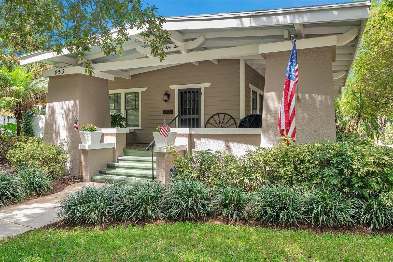 Located in the desirable Old Northeast, this charming 1920s Craftsman-style bungalow offers timeless elegance and excellent income potential. The main residence features three spacious bedrooms, a sunlit Florida room that could serve as an additional bedroom, and two full bathrooms. The wrap-around front porch with Cuban tiles and Craftsman columns welcomes you, setting the tone for the home’s historical charm. Inside, heart pine hardwood floors, coffered ceilings, and custom built-ins add to the period details. The kitchen blends classic design with modern updates, including granite countertops, a gas cooktop, and a walk-in pantry. In addition to the main home, there are two income-generating units: a one-bedroom apartment with a newly built Florida room and a sunny upstairs studio. The two-car garage has potential for conversion into another accessory dwelling unit (ADU), further increasing income potential. Off-street parking and garage space provide convenience for all residents. The property sits on a corner lot with a serene private patio, surrounded by mature trees. Just two blocks from the waterfront and a short bike ride to downtown St. Petersburg, it offers easy access to dining, shops, museums, and the iconic St. Pete Pier. Tampa International Airport is just 25 minutes away, and the nearby beaches are easily accessible. This Craftsman home blends historic grandeur with modern amenities, making it a unique gem in one of St. Petersburg’s most sought-after neighborhoods. It’s also ready for the addition of a pool, with a design and estimate already available. The property has sustained no hurricane damage and does not require flood insurance. Additionally, a new roof has been added to both the house and garage for extra peace of mind.