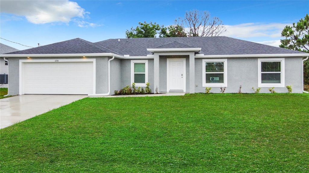 Photo of 12216 Van Gough Avenue, Port Charlotte, FL 33981 (MLS # OM709081)