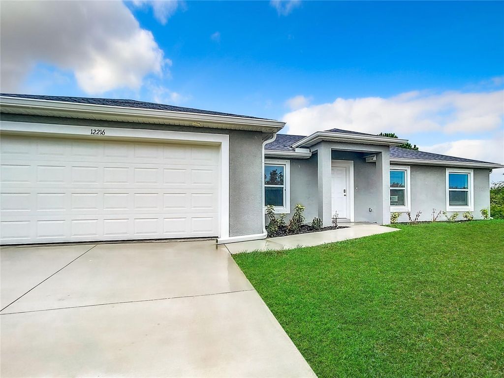 Photo of 12216 Van Gough Avenue, Port Charlotte, FL 33981 (MLS # OM709081)