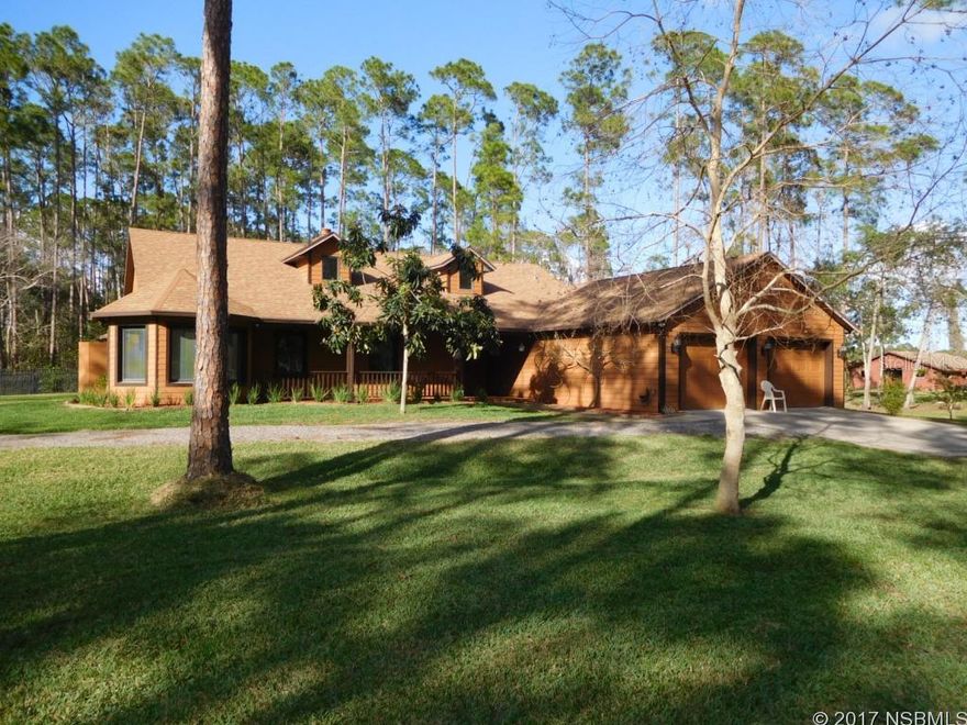 Bring your toys or horses to this charming custom built home on 5 acres, situated on a private wooded setting. You will say "wow" as you enter the expansive living/dining area which features cathedral ceilings with attractive wood beams & 3 skylights. Open floorplan provides lots of space for entertaining in this one level home. Double sided stone fireplace is located between the spacious dining area & the living room. Gourmet kitchen has corion counters, top of the line appliances, pantry, an island for bar stools and opens to a lovely breakfast nook with lots of windows to enjoy the lush back yard. All of the living areas & the guest bedroom open to a spacious screened porch which features an attractive landscaped water fountain. In addition to the 2 large bedrooms, the MBR has an adorable hexagonal shaped sitting area or office. Circular driveway leads to this attractive CBS home that has an oversized double garage with workbench & an interior utility room that can be used as a sewing room, hobby room, office or storage. Upgrades included in this stunning home are Pella windows & doors, 2 dormers which allow lots of natural light, whole house generator w/propane tank, termite bond, security system, 2 storage buildings and a newer roof. Home is situated on 2.5 acres and the 2.5 acres adjacent to the left or to the west are also included. PID 8201-01-03-0250. Approximately 1/4 of the 2.5 acre lot where the home is located is cleared and there is a fenced dog run area in the rear yard. This private wooded acreage provides a lot of wildlife to watch & enjoy, including deer, wild turkeys, cardinals, buntings, finch & quail! Make this well built & like new home yours today!