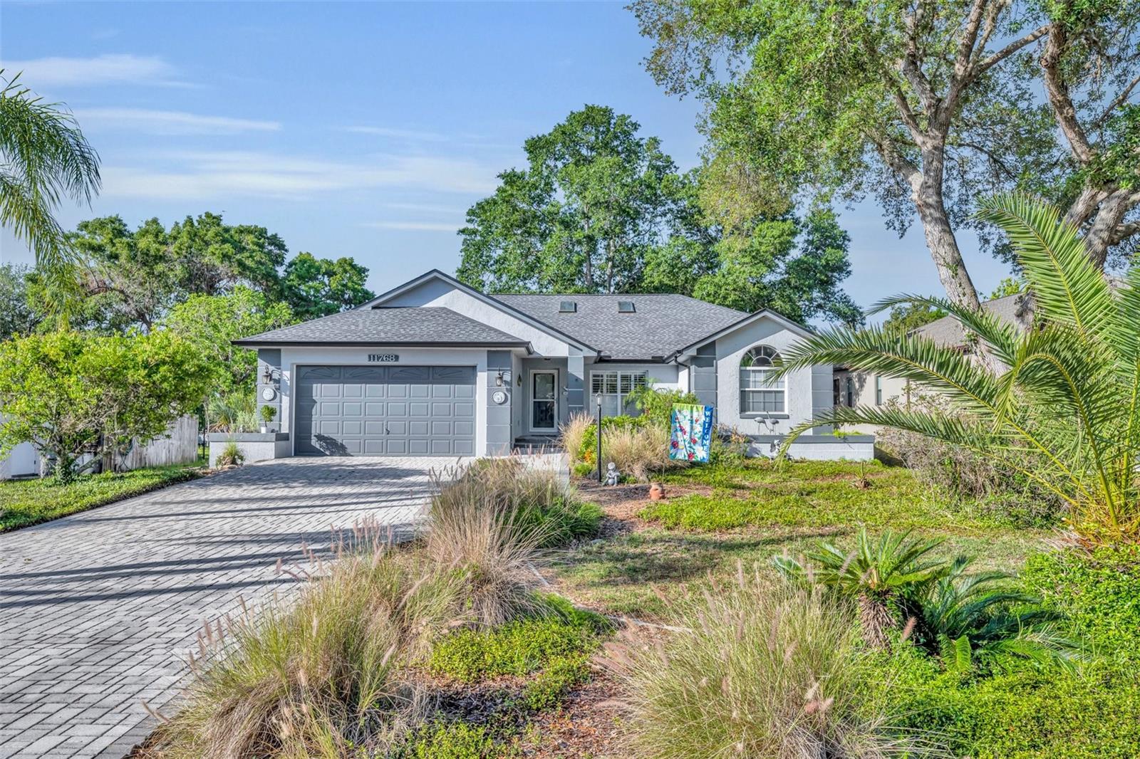 **Fabulous Waterfront Retreat in RIVERHAVEN VILLAGE – 3 Bed, 2 Bath, NEVER FLOODED!**
Welcome to your dream home in the highly desirable RIVERHAVEN VILLAGE Community, nestled on the canal with direct access to the GULF in beautiful Homosassa, Florida. This impeccably maintained 3-bedroom, 2-bath home, offers the perfect blend of comfort, style, and Florida waterfront living — and **HAS NEVER FLOODED**!
A Boaters DREAM with **TWO private boatlifts**, a paved walkway leading to a sitting area by the dock, and a cozy firepit to enjoy serene canal views where **manatees, dolphins, and wildlife are frequent visitors**.
Inside, the home boasts custom all-wood cabinetry with **granite countertops** in both the kitchen and bathrooms.
You’ll love the **WOOD-LOOK CERAMIC TILE** throughout the main living areas, complemented by **NEW LUXURY VINYL PLANK FLOORING** in the guest bedrooms. The **glassed-in Florida room** offers a versatile space—perfect as a home office or an entertainment haven. Recent upgrades include a **BRAND NEW ROOF AND GUTTERS**, **NEW EXTERIOR PAINT**, and **NEW BACKYARD DECK** in a **fully fenced, spectacularly landscaped yard**. The home is equipped with **electric storm shutters** in the rear, high-quality canvas window covers up front, and a **Generac system connected to a 400-gallon propane supply that powers most of home** for peace of mind.
Additional features:
**Skylights** (new with the roof) for natural light
**2-car garage with built-in cabinetry and a 5X10 work area**
**Located in a golf cart-friendly, scenic waterfront neighborhood**
Don’t miss the opportunity to own this one-of-a-kind waterfront gem. Schedule your private tour today!