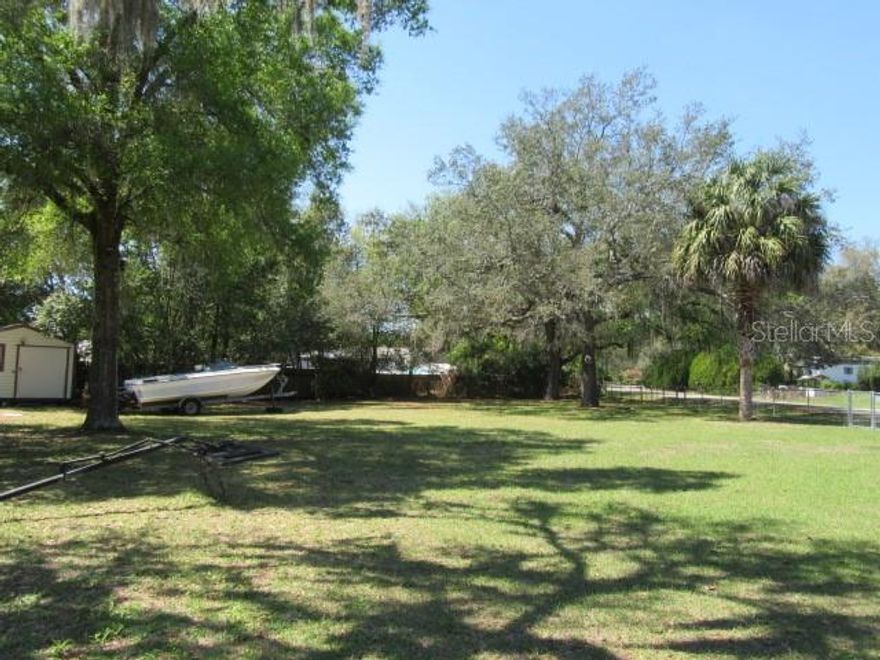 Corner vacant lot in the established community of Orange Blossom Hills, ideally located at the intersection of SE 102nd Court Rd and SE 165th Place, just blocks from US Hwy 441 and Hwy 42, between The Villages and Lake Weir. This .30-acre parcel offers a blend of open space and mature trees, creating a natural setting with plenty of flexibility for future use.

A valuable feature already in place is the approximately 10x14 storage shed, which is wired for electric, providing a head start for storage, workspace, or future improvements. The property is currently unimproved with no septic or utilities in place, allowing a new owner to design and build to their preferences.

Zoned R4 Mixed Residential, this property allows for both site-built and manufactured homes, offering added versatility for homeowners and investors alike.

With no HOA and convenient access to nearby shopping, dining, major roadways, and outdoor recreation, this property presents an excellent opportunity for a homesite or investment in a growing area of Marion County.