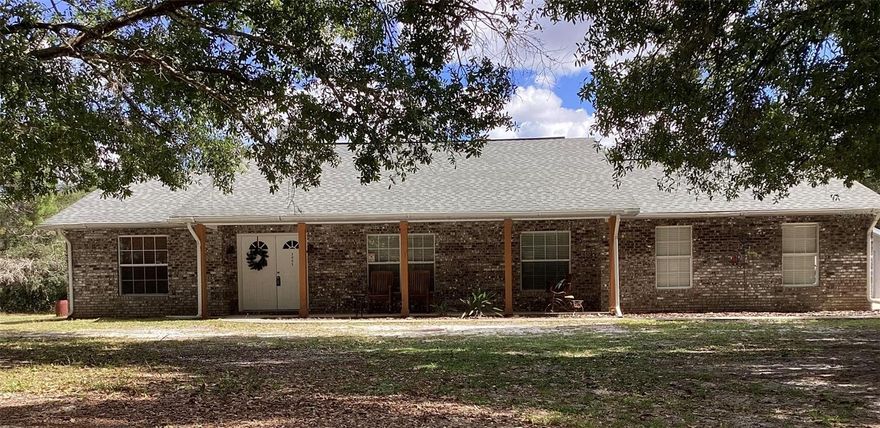 Priced to Sell! This private Oasis truly has It All!

Escape to your own private sanctuary in the desirable Bay Lake Ranch community, where peace, space, and luxury meet. Set on almost 2 acres of high and dry wooded land, this stunning property offers TOTAL privacy — and no HOA!

You will be greeted by a decorative wood fence and gated entry.  A concrete driveway winds to the main home, surrounded by mature trees.

Main Residence

The inviting rocking-chair front porch with a swing welcomes you to relax and unwind. Inside, you’ll find 3 spacious bedrooms, 2 nicely updated bathrooms, and a bonus room perfect for an office, gym, or hobby space.

The Open-concept living, dining, and kitchen area boasts vaulted ceilings and a charming brick electric fireplace, creating the perfect gathering space for family and friends. Pergo flooring thru out ( with cozy carpet in just two bedrooms)

The upgraded gourmet kitchen features:
 * Plenty of cabinetry- a great layout- perfect for the chef in your family.
 • An impressive 8-foot island with Sub-Zero beverage cooler
 • Granite countertops and stainless appliances
 
Retreat to the inviting Master bedroom with Pergo floors, soaring vaulted ceiling and private access to the pool area, complete with a relaxing en suite bathroom.
A spa inspired master bath boasts recently, remodeled, quartz counters, dual vanities, glass, enclosed shower, tile floor, and a secluded water closet. 
A luxurious jetted tub adds the perfect finishing touch to the master bathroom

Just outside -thru the French doors you can relax beneath the shade of a roofed, screened enclosed lanai overlooking a sparkling Saltwater pool with a tranquil waterfall feature.

Garages, Guest Suite & Bonus Spaces

The property’s versatility continues with a detached concrete building, offering endless possibilities.
 • 50’ x 8’ covered porch
 * Bar counter with cabinetry.
 • Full bathroom with shower
 • Professionally set-up pool table
 • Queen Murphy bed is perfect for guests
 • Projector setup — perfect for a guest suite, media room, or game room
 • Attached climate-controlled 2-car garage

In total, the property provides 4-car garage capacity, a 2-car carport with electric on concrete, 12’ x 24’ shed with power — plenty of room for vehicles, RV’s, trailers, equipment, or hobbies.

Outdoor Features & Upgrades
 • 2 private wells for reliable water access
 • RV/Generator outlet
 • New roofs (2018) on both buildings
 • New septic tank and drain field (2023)
 • New water heater (2024)
 • Fenced on three sides
 • Outdoor lighting enhances the ambiance after sunset

Location & Community

Bay Lake Ranch is known for its spacious, custom homes and friendly, country atmosphere — located just 30 minutes from Orlando and the beaches. Families appreciate the proximity to the excellent Harmony School District, shopping, restaurants, and healthcare. Residents enjoy a strong sense of community, with annual Halloween hayrides and a holiday tour of lights that make this neighborhood truly special.

This private country estate offers the perfect blend of luxury, comfort, and rural charm — all at an exceptional value. Don’t miss your opportunity to own this one-of-a-kind retreat that truly has it all.

Room sizes are approximate and should be verified for accuracy.

Schedule your private showing today — this gem is priced to sell!