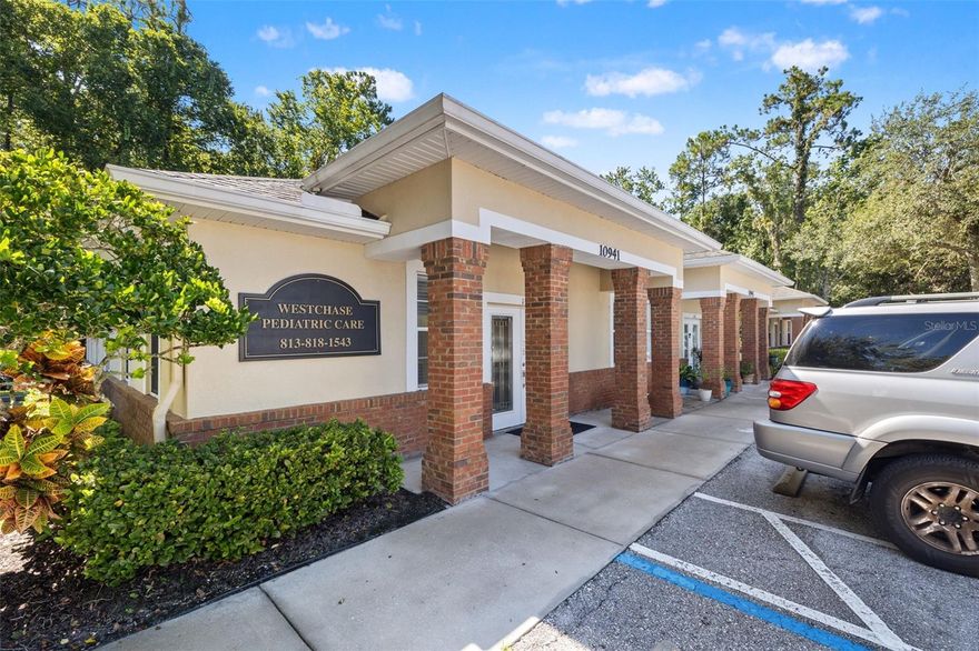Offered is a 3,000 sq ft professional office duplex in the heart of Westchase, one of the Tampa Bay region’s most exclusive and sought-after communities. This property is currently leased, making it ideal for an investor, however there is opportunity for an owner-user to use one of the units immediately after closing; inquire for details. The two units are mirror-images of each other and include a waiting room, large reception and admin space, four exam rooms, a bathroom, lab, and break room. A rear entrance in each unit provides owners and staff with a discrete, private egress away from clients in the waiting room. The complex’s ample parking can accommodate even the most parking-intensive users. An emergency generator has been added to the property for one of the units, perfect for a medical office that needs to store temperature-sensitive medications and vaccinations. The offices are conveniently located adjacent to the complex’s mailboxes and trash facilities. A prominent monument sign along Countryway Blvd provides unparalleled exposure to passing traffic. Owners, tenants, staff, and customers will all appreciate the convenience of being walking distance to a Publix-anchored shopping plaza featuring several restaurants, as well as a clean and well-lit 7-Eleven convenience store and gas station. Other nearby businesses include Truist, Wells Fargo, a dry cleaner, and a UPS Store. Current tenants include a salon and a (vacant) pediatrician’s office. The salon intends to stay, and their lease renewal is currently being negotiated. The pediatrician’s office has 2-3 years remaining on their lease, however if an owner-user was interested in taking over the space, they have expressed willingness to pay to buy out their lease, freeing the space up. Access to SR 589 Veterans Expressway is just 10 minutes to the east. Tampa International Airport (TPA) and St. Pete/Clearwater International Airport (PIE) are 18- and 30-minutes away, respectively. Don’t miss this opportunity!