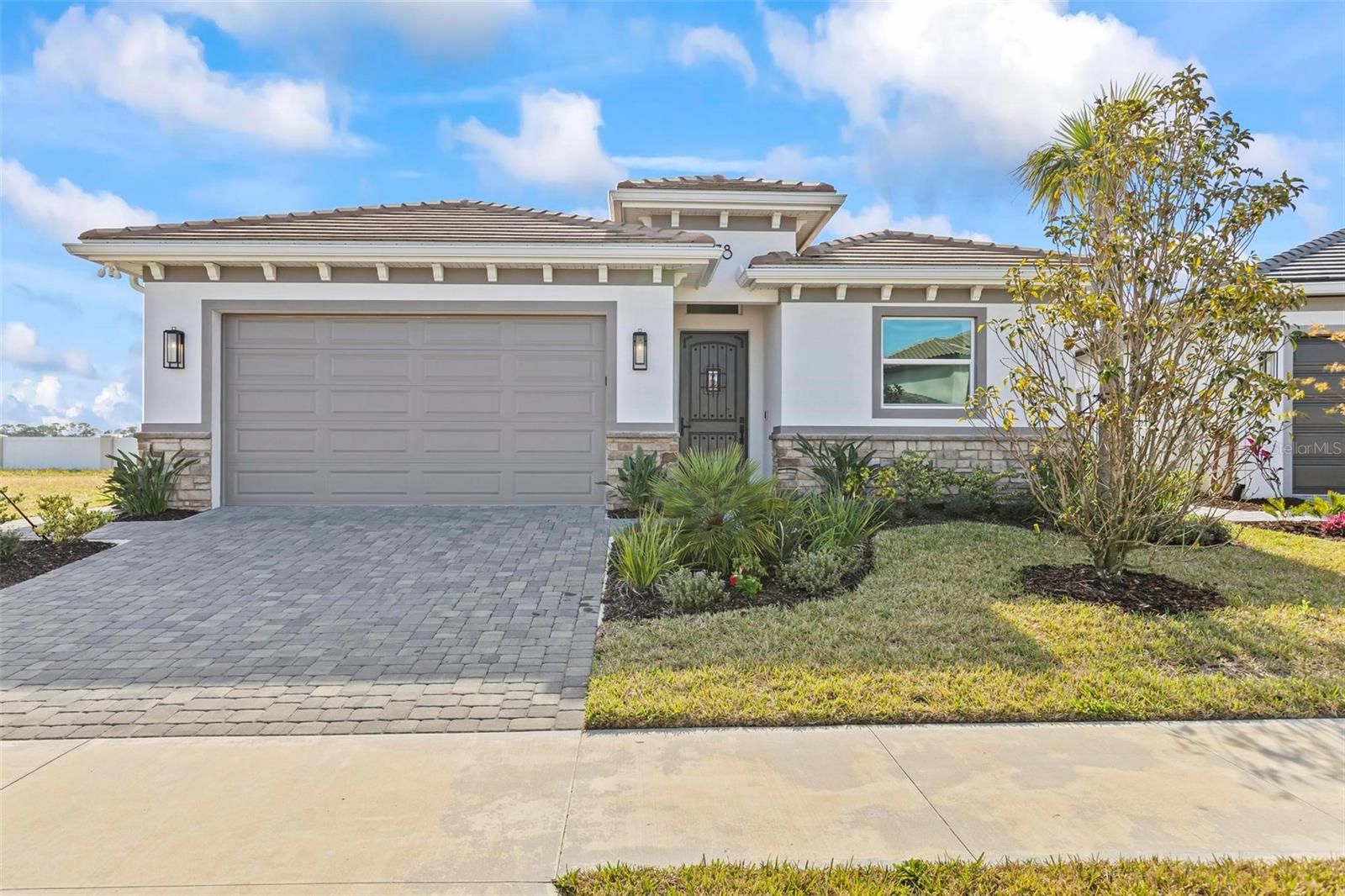 BOATER'S DREAM LIVING - This 2023 built home is just under 2,500 square feet and offers 4 Bedrooms, 4.5 bathrooms, plus an additional 300+/- sq.ft. garage. The Home can be delivered FURNISHED or UNFURNISHED depending on your needs. Located within the newly designed Marina Del Palma Yacht Club, this home offers coastal luxury living at it's finest. Club amenities include a Gated/Security driven community, Newly Built Club house and community center with swimming pool and spa overlooking an artery of the Matanzas River, fitness center, tennis, pickleball, a dog park, biking paths & walking paths are all nearby. The interior of the home is bright and sunny from every room with an open floor plan boasting a spacious family room, gourmet kitchen and breakfast area. Each bedroom boasts a private bathroom and most with their own walk-in closet; Enjoy the beautifully maintained upgraded hardwood flooring throughout, a fully screened in lanai with kitchenette & hurricane impact windows. Pets are permitted, however, breed and weight must be approved with the Owner. While the complex is located within Palm Coast, there is only a short 5 minute drive over the bridge to central Flagler Beach with immediate beach access plus a ton of restaurants & shopping. Nearby Historic St. Augustine and Daytona Beach are also both within a short ride. This home is available for a minimum that 6 months and a day, however a yearly rental year is preferred. Call for your exclusive showing of this luxurious home. Tenant pays Utilities including Water, Sewer, Garbage & Cable/Internet fees. Room Dimensions are approximate, Walk-in Closet Dimensions available on request and most rooms boast 10' ceilings. Concierge Boat Service including indoor/dry storage space for up to a thirty (30') foot boat can be made available at an additional fee.