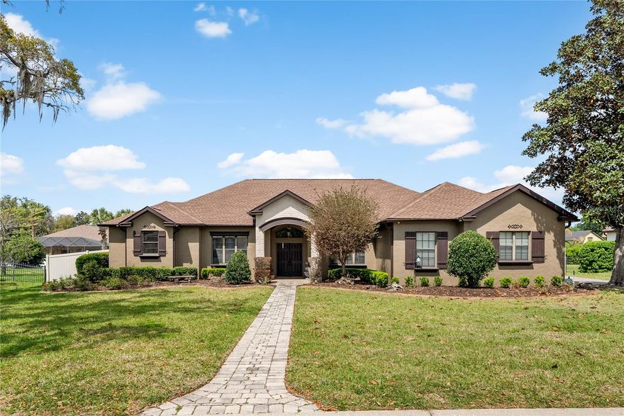 Located in the gated southeast Ocala community of Devonshire, this 4 bedroom, 3 bathroom home offers 2,575 living square feet on 0.36 acres with the space, layout, and location that continue to make this side of town so desirable. Just 3 miles from Downtown Ocala, Devonshire is a smaller gated community where opportunities like this do not come available often.

Inside, the home features high ceilings, crown molding, and tile and wood flooring throughout. The layout offers both flexibility and function with a formal living room, a formal dining room currently used as an office, and a centrally positioned kitchen that opens to the family room. With abundant cabinetry, an island, and strong flow to the main gathering spaces, the kitchen sits right at the heart of the home.

The split bedroom floor plan is well designed, with two bedrooms and a full bath on one side, while the primary suite is tucked away for added privacy on the other. A fourth bedroom and full bath across the hall create an ideal setup for guests, multigenerational living, or a future pool bath. The primary suite offers a spacious retreat with wood floors, a walk-in closet, dual sinks, a soaking tub, and a walk-in tile shower.

French doors and sliding glass doors create an easy connection to the covered back patio, adding to the home’s flow for everyday living and entertaining. Outside, the covered patio, vinyl fencing, and paver driveway add to the home’s appeal, while a 2021 roof offers added peace of mind. Located in sought-after southeast Ocala near shopping, dining, and daily conveniences, this home delivers a rare opportunity in one of the area’s more established gated communities.