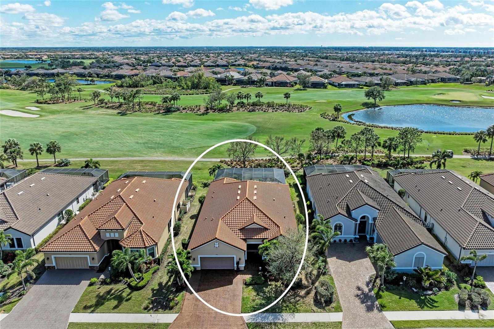 HUGE PRICE IMPROVEMENT- Save Over $125K!!!*** Experience the pinnacle of golf-front living with the coveted Pallazio floor plan at Esplanade Golf & Country Club. This exquisite home not only offers a Golf deeded lot/FULL GOLF MEMBERSHIP but also boasts a captivating southern exposure, providing endless vistas of the manicured fairways and greens. Upon entering the grand foyer through double doors, you are greeted by adorned columns, a tray ceiling, and soaring ceilings flowing into the expansive open-concept great room featuring crown molding, a tray ceiling, and recessed lighting, bathed in natural light from the disappearing pocket sliding doors opening to the lanai overlooking an amazing 40’ pool, ideal for swimming laps or leisurely enjoyment. The gourmet kitchen showcases Cambria quartz countertops, a decorative crema marfil marble backsplash, and a suite of stainless-steel appliances, including a natural gas cooktop and built-in oven. The oversized island, highlighted by chic pendant lighting, offers ample storage cabinets and is perfect for meal preparation and entertaining. A wine refrigerator adds a luxurious touch to the extended kitchen, which includes a separate breakfast area with sliding glass doors opening to the lanai. The grand primary bedroom, secluded from the guest rooms, has been extended and features a spacious en-suite bathroom with dual sinks, a frameless glass shower, a soaking tub, a private water closet, and a large primary closet. Two guest bedrooms-one with an en-suite bathroom featuring a frameless glass shower and quartz countertops, and another with access to a separate bathroom with quartz countertops and a shower/tub combination—provide comfort and privacy. The generously sized study/den, accessed through newer double doors, offers a versatile space for work and can be easily converted into a fourth bedroom. Outside, the extended screened lanai offers a generous covered area and an expansive paver deck with endless golf course views, inviting you to enjoy Florida's outdoor lifestyle. Motorized hurricane screens add convenience and protection. The driveway was professionally extended to accommodate three cars, ensuring ample space for residents and guests alike. Additional benefits include a roomy laundry room with a built-in utility sink, under-cabinet storage, a drop zone, and garage access, while the epoxy-floored two-car garage boasts multiple overhead storage racks. The gated community offers a wealth of amenities, including an 18-hole championship golf course, tennis and pickleball courts, two fitness centers, two resort-style pools, a full-service spa with a salon, on-site dining at the Bahama Bar and the more sophisticated Barrel House Bistro offering fine dining and cooking classes, bocce ball, a bark park, and endless scheduled events that will fill your social calendar. Lawn maintenance is included in the HOA fees. The award-winning Lakewood Ranch offers a variety of shopping and dining options and is located near University Town Center, the Polo Club, local farmers’ markets, over 150 miles of trails and parks, famous beaches, and SRQ and TPA airports. Don’t miss this opportunity to own this meticulously designed home in one of Florida's premier communities. Furniture available by separate agreement.