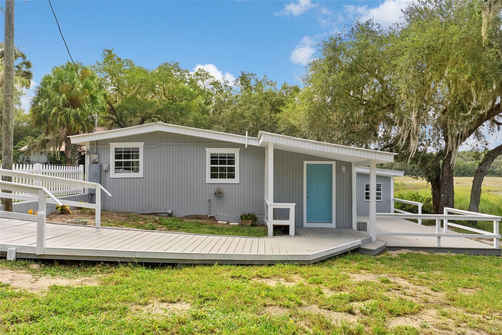 Fully Renovated Peaceful Paradise on Over 2 Acres
Escape the noise and discover peace and serenity in this beautiful, fully renovated 3-bedroom, 2-bathroom home nestled on over 2 acres of lush, private land in charming Ocklawaha, Florida.
From the moment you arrive, you’ll feel the calm of nature surrounding you with towering trees, open skies, and room to breathe. Step inside to find a bright, airy interior where every detail has been thoughtfully updated. The home features new flooring, new appliances, modern fixtures, fresh paint, and a beautifully updated kitchen and bathrooms—offering a perfect blend of style, comfort, and function.
The open floor plan is ideal for entertaining or relaxing, and the split-bedroom layout offers privacy and space for everyone. The primary suite is a true retreat, complete with a renovated en-suite bathroom and spacious closet.
Adding to the charm, the property sits along a peaceful lake run-off, creating the perfect setting for wildlife watching, kayaking, or simply soaking in the natural beauty right in your backyard.
Whether you're enjoying coffee on the front porch, stargazing at night, or exploring your own private acreage, this property delivers the tranquil lifestyle you've been dreaming of.