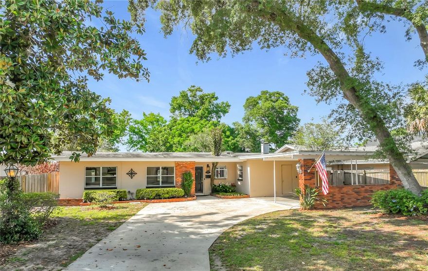 Rare LAKEFRONT + CORNER LOT opportunity in one of Audubon Park’s most sought-after neighborhoods! Perfectly positioned on Lake Caydee, this exceptional property sits on an oversized ½+ acre lot, offering endless potential for both homeowners and investors alike. Whether you’re dreaming of creating your forever home or building a custom estate on prime lakefront land, this homesite delivers. Lovingly maintained by its original owner, the home features a spacious front yard, an oversized driveway and a two-car carport. Step inside to a light-filled living room where stunning lake views greet you immediately. French doors open to a serene deck—ideal for entertaining, quiet mornings, or enjoying picturesque sunsets over the water. The home includes 3 bedrooms, 2 bathrooms, a dedicated office space, a kitchen (offering both gas & electric) with separate dining area, beautiful wood shutters, ceiling fans, and an expansive laundry/mudroom. The backyard is beyond dreamy where mature trees and lush landscaping frame the lake beautifully, creating a truly tranquil and private setting.
Enjoy an absolutely unbeatable proximity to top-rated Audubon Park K-8 School, along with local favorites like East End Market and Harry P. Leu Gardens. Nestled within the vibrant Audubon Park Garden District, this home offers a walkable, bike-friendly lifestyle surrounded by charming shops and dining.
Opportunities like this are rare—schedule your private showing today.