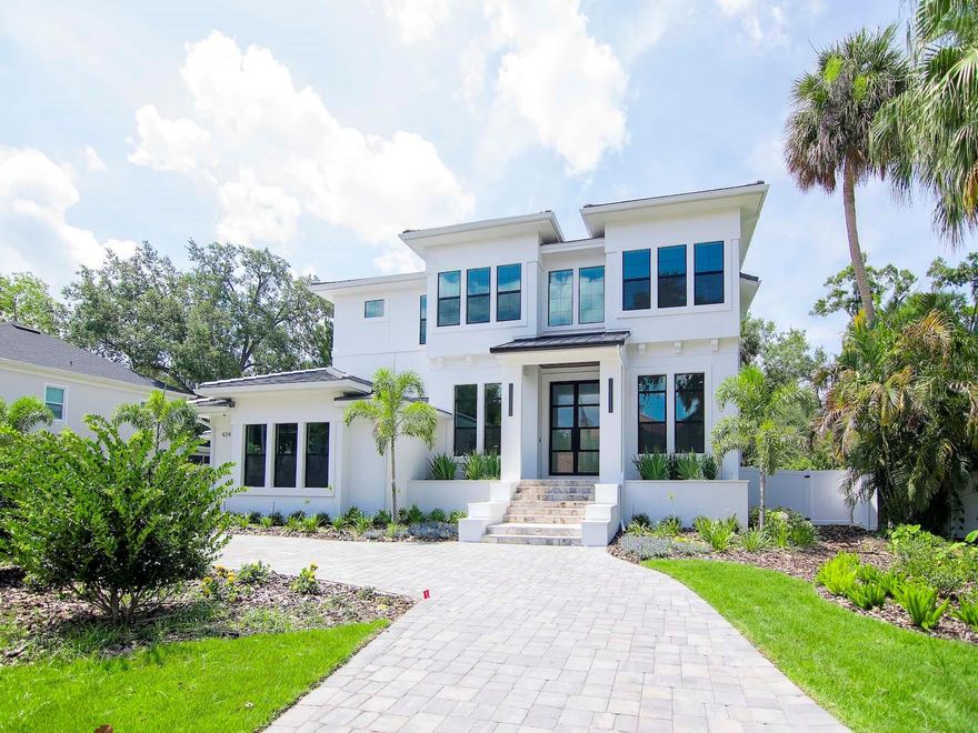 Welcome to Taralon Homes newest creation in Beach Park. This 4 bedroom, 4.5 bath pool home is situated on a 106x145 lot and features custom transitional architecture with a contemporary flair and clean lines. The 2 story foyer welcomes you in and is flanked by the study/living room and dining room and opens into the spacious great room w/ a fireplace overlooking the incredible lanai area. The chef's kitchen includes an informal dining area, a large center island, Wolf/SubZero appliances, 42" maple, shaker style cabinets and granite countertops. The downstairs also includes an ensuite, a large game room w/ a wet bar that offers a beverage center and wine cooler plus a laundry room and mudroom. Upstairs you will find the owner's retreat with 8' double entry doors and tiered ceilings from 10' to 10.8', a custom walk-in closet plus a luxurious master bathroom. In addition there are  2 en-suites plus a media room and laundry room and a 4 car garage. Relax on the spacious lanai w/ an outdoor kitchen overlooking the pool. Additional features include: 7.5" plank white oak flooring throughout with porcelain tile in the laundry and bathrooms, 7" crown molding and baseboards and an elevator. Minutes to TIA, International Mall, fabulous restaurants, Hyde Park Village, downtown and the Gulf beaches! Room Feature: Linen Closet In Bath (Bedroom 4).