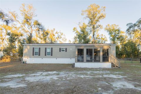 Photo of 396 NE Beverly Hills Drive, Mayo, FL 32066 (MLS # OM716834)