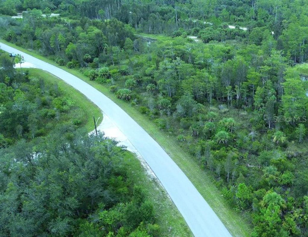 Photo of 486 Westchester Drive, Lehigh Acres, FL 33972 (MLS # TB8460886)