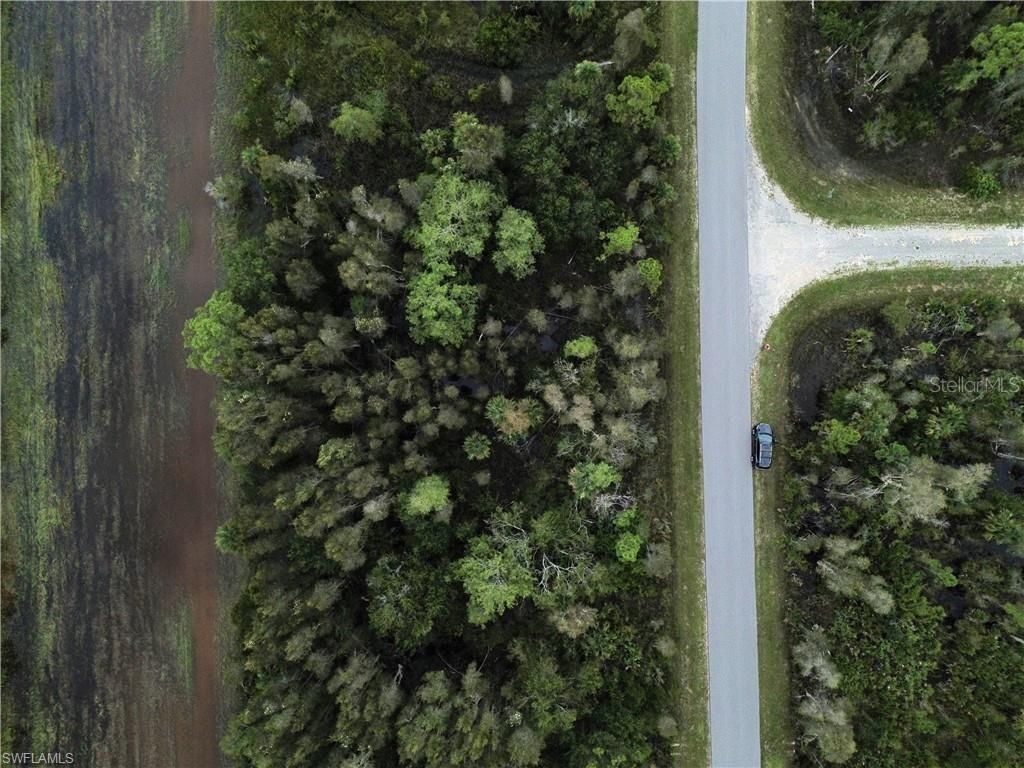 Photo of 486 Westchester Drive, Lehigh Acres, FL 33972 (MLS # TB8460886)