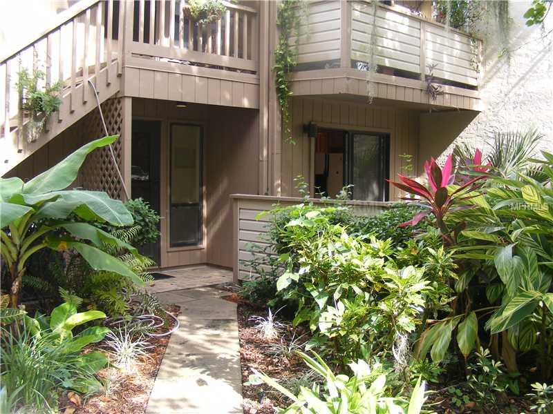 Welcome to this darling 2 bed/2 bath ground floor condo! Pride of ownership beams brightly here --with an updated kitchen and a private enclosed court yard where U can enjoythe sunlit views...Ceramic tiled floors all throughout the condo. Note the lanai that affords extra living space for friends and family and boasts a fabulous private wooded view and also just steps to the Brookhouse pool. The 2nd bedroom is "convertible" and may be used as you wish, open it up for extra living space or close off when needed as a guest suite. Enclosed laundry room off of lanai is so convenient.... Amenities included in this community that was just rated Best Condominium of 2012 include 24 hour gated security w/ guard, 6 heated pools, 3 clubhouses, 4 lighted tennis courts, shuffleboard, basketball, dog walk area and so much more... . Unbeatable amenities in this community include marina with 87 boat slip harbor, 6 heated swimming pools, 4 tennis courts and 5 miles of walking trails and boardwalks. This pet friendly resort lifestyle with art studios, social clubs, and exercise classes are just a few of the activities to take part in...This unit is not to be missed...