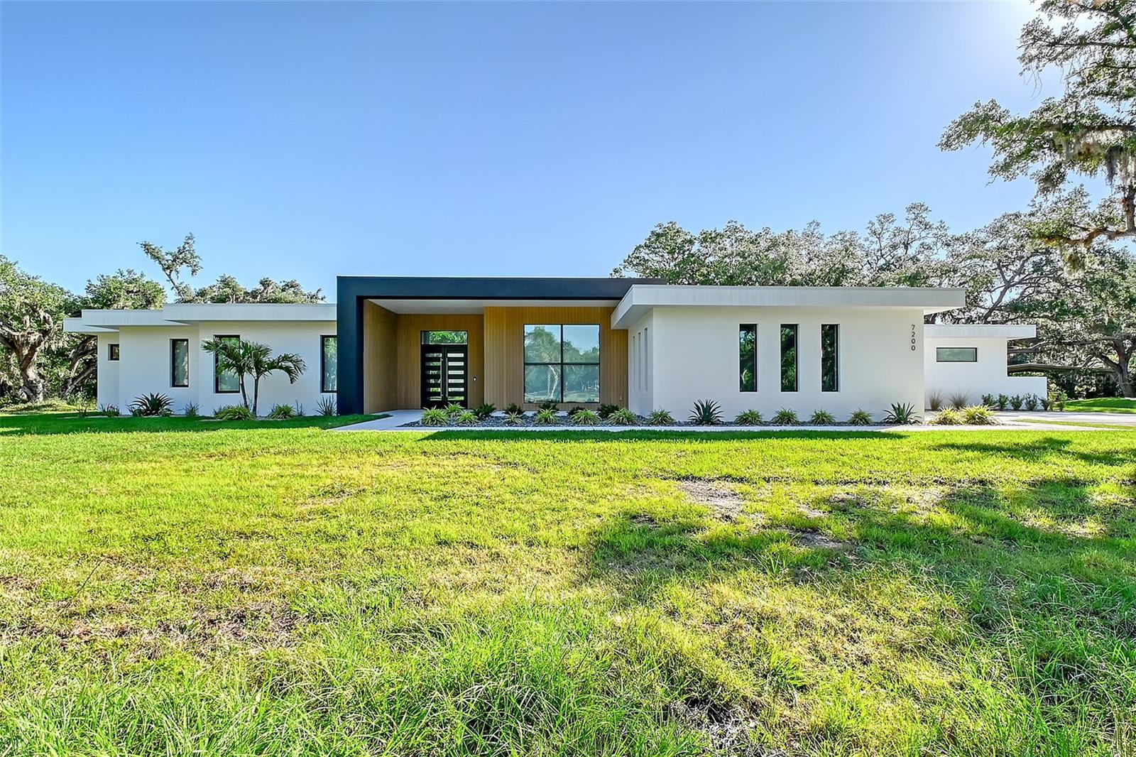 One or more photo(s) has been virtually staged. Experience unparalleled luxury and privacy with this brand new modern masterpiece custom-built by Jonas Yoder Homes. Nestled on 6.7 lush acres with mature trees, this exclusive estate features a stunning 4-bedroom, 4-bath main residence plus a fully equipped 1-bedroom guest house with living room, kitchen, and full bath—ideal for extended family or guests.
Crafted with meticulous attention to detail, the home boasts sleek Thermador appliances, induction cooking, a spacious butler’s pantry, and Lutron smart shades throughout. The expansive master suite offers a serene retreat with spa-like finishes, while each additional bedroom enjoys its own en-suite bath.
A rare find, the property also includes a private airplane hangar, a cooled garage, brand new septic system, and a new well—delivering both modern convenience and future-ready infrastructure. Uniquely, this property is the only one in the community confirmed by the HOA to have the potential for a private runway for small aircraft, offering a truly unmatched aviation lifestyle opportunity.
Designed for those who value privacy, luxury, and exceptional quality—all in a prime location.