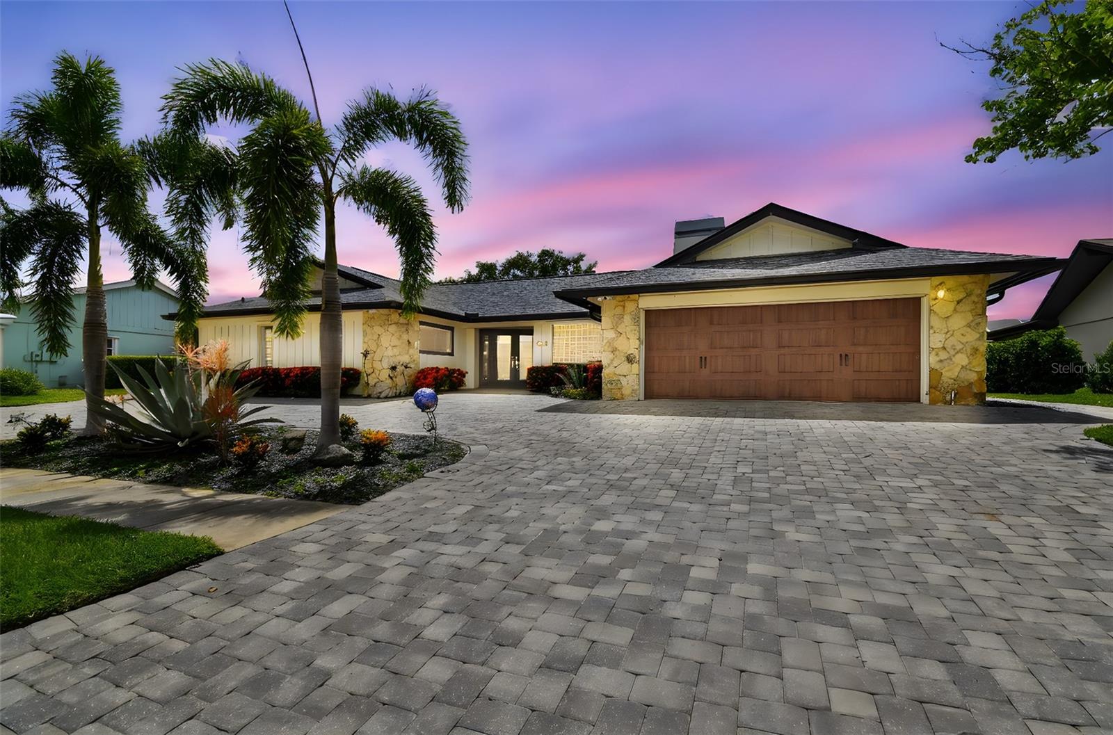 WATERFRONT – MINUTES TO THE BAY – Stunning 4 Bedroom – 2 Full/ 2 Half Baths w/Bonus Climate Controlled Storage Room. Spectacular, unobstructed sunset views from the West facing back yard in the highly coveted Sweetwater Estates. Minutes to Tampa Airport, Berkeley Prep and International Mall. Large Dock with 20,000 lb - 4 motor remote boat lift and separate motorized jet ski/kayak lift. This home was total renovated in 2018 and boasts upgrades throughout – Custom Built Kitchen Cabinets -Central Vac - Ring camera system/Alarm/Smart Huse/Quartzite Countertops/Custom Built Bar Area designed for entertaining/Level 4 plaster/Epoxy garage floor/ Paver Driveway-Rear Patio & Side Walkways/Wood Burning Fireplace/New Electrical Wiring/New Impact Doors & Windows. Master Suite with Spa type Master Bath. Bonus side yard with private firepit under a one of a kind Oak with accent lighting. Must be seen to be appreciated. This is your chance to live in a centrally located and highly desirable waterfront community less than 20 minutes from St. Pete, Ybor City, Carrollwood or So. Tampa in a home that was unaffected by recent hurricanes.