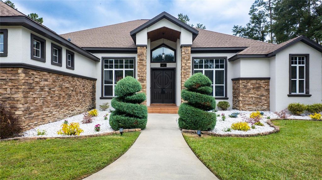 Photo of 617 SE 47th Loop, Ocala, FL 34480 (MLS # OM708037)