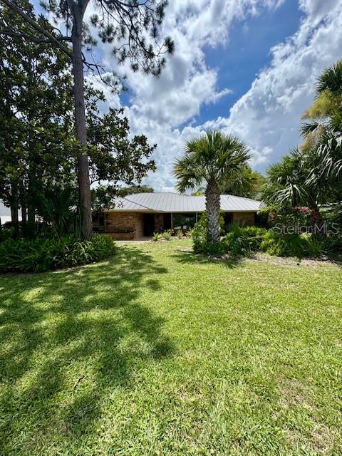 Available starting September 1, 2025, this charming custom built brick home at 156 Live Oak Court is located in the exclusive Sugar Mill Country Club, quietly tucked away at the end of a cul-de-sac and surrounded by lush natural vegetation with numerous nature trails. Featuring 3 bedrooms, 2.5 baths, and a spacious 2-car garage, the home offers both privacy and comfort. The layout includes formal living and dining rooms complete with a 2-piece china cabinet plus a cozy family room with built-in bookshelves and an entertainment center. A large 16 x 20 screened-in porch opens to a fully fenced 30 x 30 pet-friendly yard, equipped with gates on both sides and a doggie door for convenience. The backyard itself extends even farther, offering ample space to enjoy the peaceful outdoor setting. One small dog may be considered. pet is negotiable. Experience the serene lifestyle and mature landscape of Sugar Mill from this quiet, well-appointed retreat. If tenant would like to use the amenities at Sugar Mill, including pools, clubhouse, tennis, pickleball and golf, they will need to acquire their own membership.
