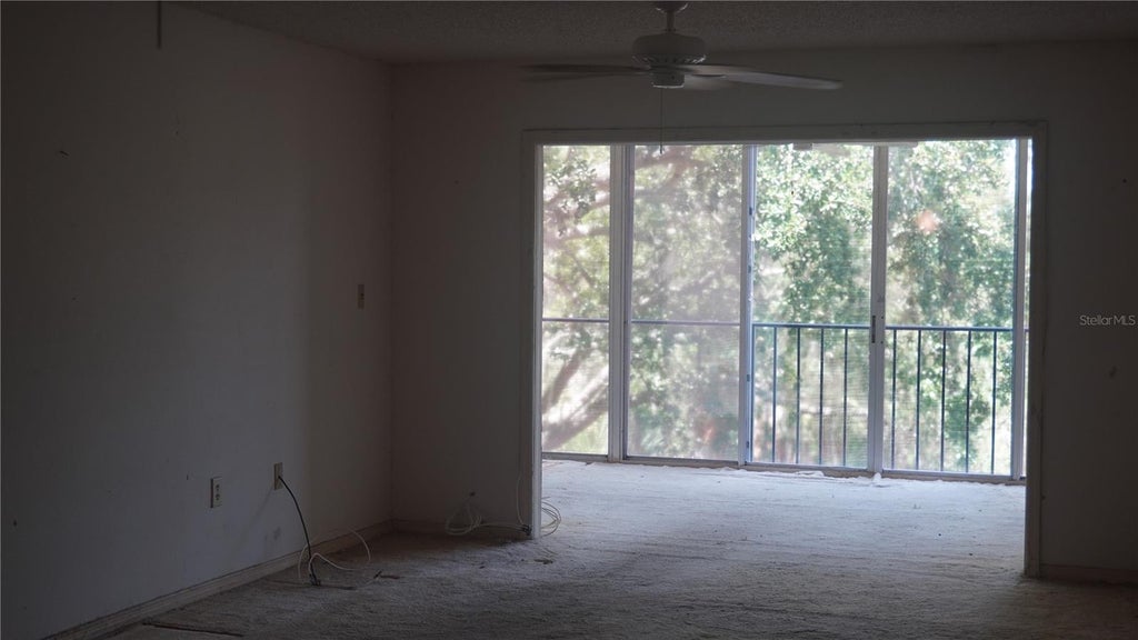 Photo of 90 S Highland Avenue #202, Tarpon Springs, FL 34689 (MLS # TB8532552)