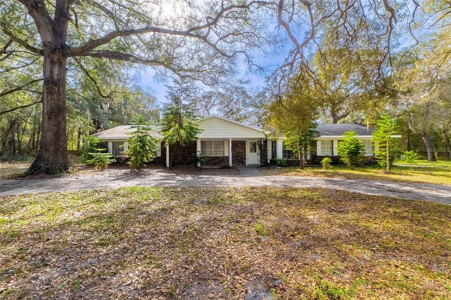 Almost 3 acres of land with no HOA in DeLand. This 3-bedroom, 2-bathroom home sits on 2.78 acres and offers a unique opportunity to fully renovate the existing home or start fresh and build something new. The backyard includes an enclosed porch perfect for relaxing or entertaining, plus a 20-foot by 20-foot steel storage building ideal for a workshop, hobby space, or extra storage. Conveniently located, this property is 6–15 minutes from grocery stores, pharmacies, and nearby hospitals. It’s 20 minutes from Blue Spring State Park and 45 minutes to Daytona Beach. Enjoy the peace and quiet of your own land while staying close to everyday essentials. If owning a big piece of land and completely customizing or building a home is on your radar, come take a look!