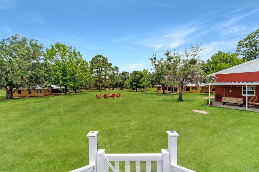 Welcome to a one-of-a-kind opportunity in the NW side of Marion County nestled on 9.30 acres. Whether you're searching for a multi-generational setup, investment opportunity, or a peaceful retreat with room to grow, this farm delivers flexibility, comfort, and privacy in a scenic and accessible location. At the heart of the property are 2 well-appointed homes, each offering over 1,600 square feet, three bedrooms, and two full bathrooms. Both residences were thoughtfully updated in 2019 with granite countertops, new kitchen cabinetry, modern flooring, French doors, updated water heaters and HVAC systems, and durable metal roofs. The kitchens offer ample cabinets and counter space, while each home also features a spacious, screened, fan-cooled porch that provides panoramic views of the property—perfect for enjoying morning coffee or quiet evenings outdoors. Each home has concrete block construction, double-pane windows, and its own septic system and well, both with new pumps installed within the past 18 months. The layout of the homes—one positioned on each side of the property—offers natural privacy, making it ideal for extended families or for living in one home while renting out the other. The homes are move-in ready and currently furnished, with furnishings negotiable. Beyond the homes, this property is loaded with features that enhance its versatility and lifestyle appeal. A nearly 2,400-square-foot detached garage offers endless possibilities. With four overhead doors—two standard and two 10’ doors for larger vehicles—plus hot water, electric, multiple workbenches, and storage space for six or more vehicles, this garage is a standout feature. Attached to the garage is a charming one-bedroom, one-bath apartment, perfect for guests, a caretaker, or as a rental opportunity. Next to the garage is a concrete RV pad with full hookups including water, electric, and septic. There's also a covered carport, additional storage shed, and an above-ground pool with an attached sun deck for relaxing after a day outdoors. Equestrians and animal lovers will appreciate the property's fenced pastures and paddocks. Two horse stalls, a large fenced pasture on the south side, and two more paddocks on the west side all feature individual water access points. The gently rolling land is shaded by mature oaks and pines, dotted with crepe myrtle and loquat trees, creating a naturally beautiful and serene environment. Access to the property is secure and private, thanks to the electric gate with wood beams and iron accents that open to a winding drive beneath the canopy of trees. Whether you’re raising animals, running a home-based business, or simply enjoying the quiet country lifestyle, you’ll find everything you need here. The location is as convenient as it is peaceful. You're just a short drive from Williston's shops restaurants and shopping, and you are surrounded by world-class natural attractions including Devil’s Den, Blue Grotto, and Cedar Lakes Woods & Gardens. HITS Post Time is approximately 12 miles away, the Ocala Jockey Club is about 11 miles, and the World Equestrian Center is less than 20 miles away. Cedar Key on the Gulf Coast—with its laid-back charm, fresh seafood, and fishing—lies just under 60 miles west. Whether you’re looking for a smart investment, a forever home, or a turnkey family compound, this exceptional property combines location, flexibility, and lifestyle. Seller financing available with substantial down payment.