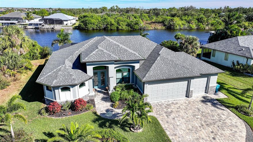 A beautifully designed waterfront retreat offering the best of Florida living on a Gulf-accessible waterway. This three bedroom, two bathroom split floor plan opens to an outdoor setting that immediately sets this home apart. The heated saltwater pool overlooks the wide double canal, creating an impressive waterfront view that captures the true essence of life on the water.

Inside, high ceilings and tile flooring throughout create a clean and inviting atmosphere. The kitchen includes soft-close cabinetry, stainless appliances, and stunning granite countertops, and connects easily to the open main living area. Sliding doors lead to the screened outdoor space where the pool area serves as the heart of the home, offering a peaceful place to enjoy morning sun, quiet afternoons, and evenings with gentle canal breezes.

The tropical landscaping adds color, privacy, and a relaxed resort-style setting, making the backyard feel like your own private getaway. Whether you are entertaining, unwinding after a day on the water, or watching boats pass through the canal, this home delivers a waterfront lifestyle buyers instantly connect with. 

Boaters will appreciate the direct access to open Gulf waters and the excellent fishing this area is known for. The property also features a three-car garage plus an additional 11 x 11.5 ft. garage bump-out, perfect for storage, a workshop, or parking for a golf cart.

Additional updates included are hurricane roll down sun screen screen, spray foam insulation, 3 zone AC with 10 year transferable warranty for parts and labor, 18 foot garage door, new irrigation pump connected to canal and upgraded landscape. 

Located less than 9 miles to the Boca Grande Causeway and 10 miles to Englewood Beach, and minutes from public golf courses, marinas, dining, shopping, and everyday conveniences, this home offers the ideal blend of location, comfort, and waterfront living. Thoughtfully designed and beautifully maintained, 8106 Santa Cruz Dr stands out as a standout opportunity for buyers seeking luxury, nature, and true coastal Florida living.