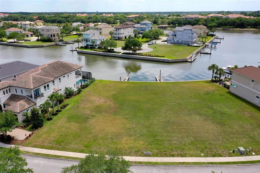 An Exceptional Waterfront Homesite in Yacht Harbor Village!! Presenting a rare opportunity to secure a waterfront lot in Yacht Harbor Village—located in the Hammock of Palm Coast. This prime homesite delivers a commanding presence with Intracoastal Waterway views and a floating boat dock already in place, setting the stage for effortless coastal living. Ideally positioned within Harbor Village Point, the lot enjoys a coveted western rear exposure, offering sweeping sunset views down the main saltwater canal as it leads toward the Intracoastal inlet. From sunrise reflections to evening skies, the water views here are nothing short of spectacular—an unmatched backdrop for a custom-built residence designed to maximize its surroundings.
Yacht Harbor Village is a refined waterfront enclave located just off A1A, where luxury meets lifestyle. Owners have the option to enjoy the Hammock Beach Marina with 209 boat slips available for rent, along with access to select Hammock Beach Resort amenities including an Intracoastal-front swimming pool, fitness center, tennis and pickleball courts, and the elegant Yacht Harbor condominium lobby. Resort membership required for amenity access. Opportunities of this caliber—combining size, location, water access, and panoramic views—are increasingly rare. This is more than a homesite; it’s the foundation for a legacy coastal estate in one of Palm Coast’s most exclusive waterfront communities. Schedule a private tour today and explore the possibilities of life on the Intracoastal.