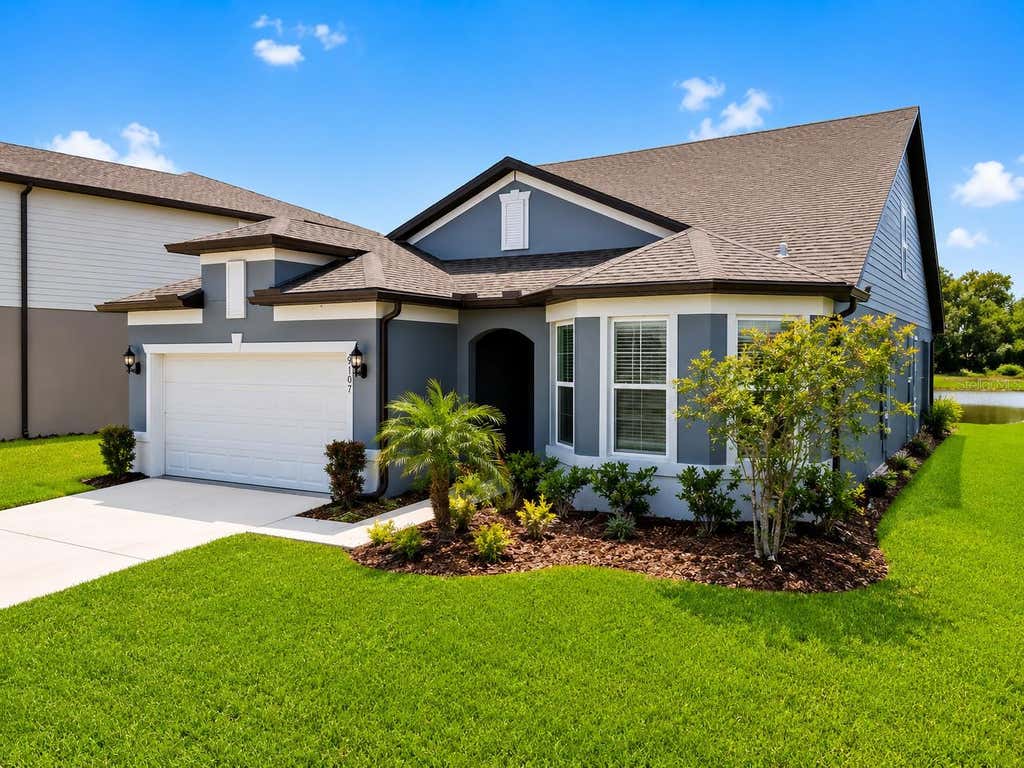 Photo of 9107 Rally Spring Loop, Wesley Chapel, FL 33545 (MLS # TB8512104)